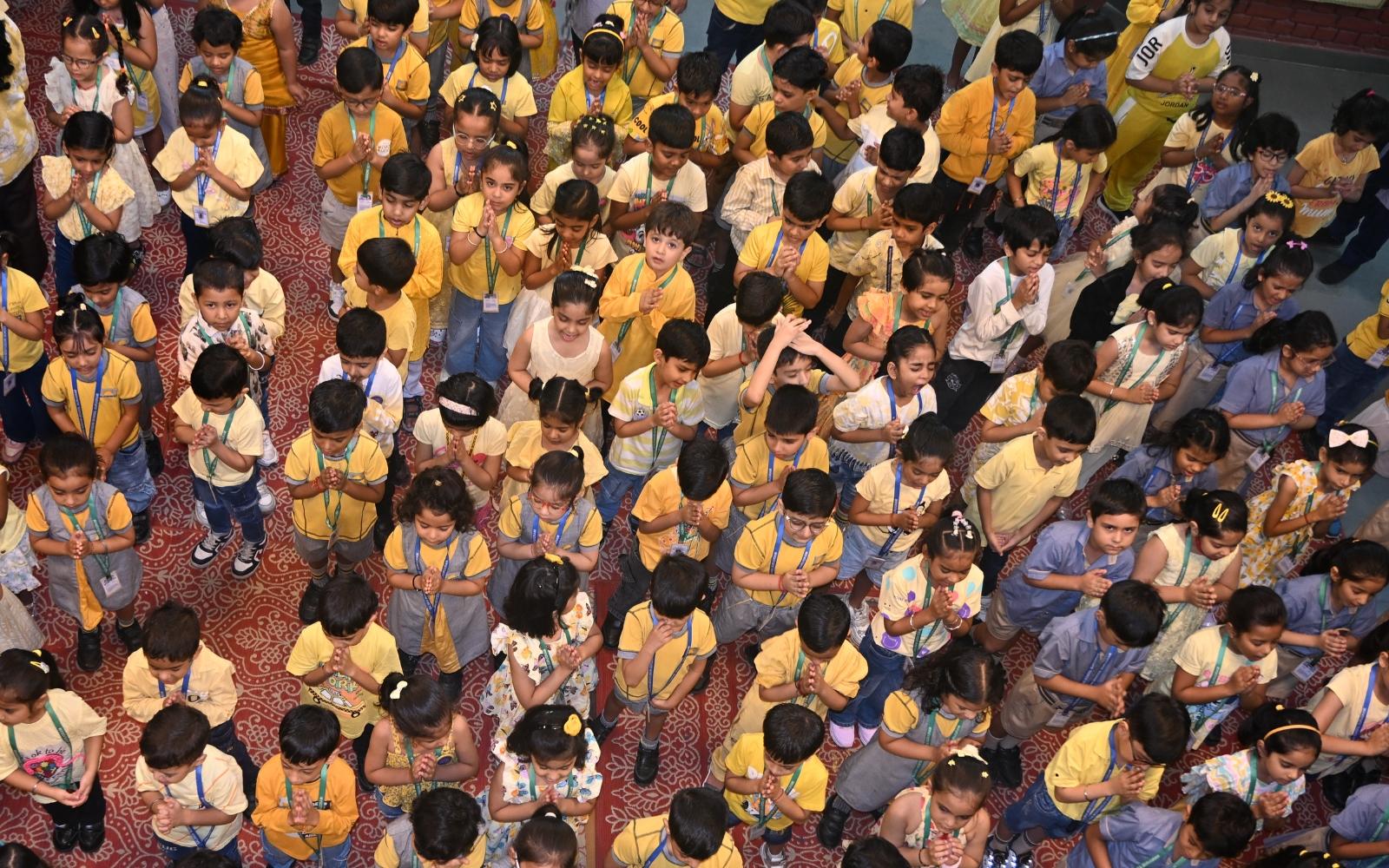 Young learners gathered together in the school courtyard