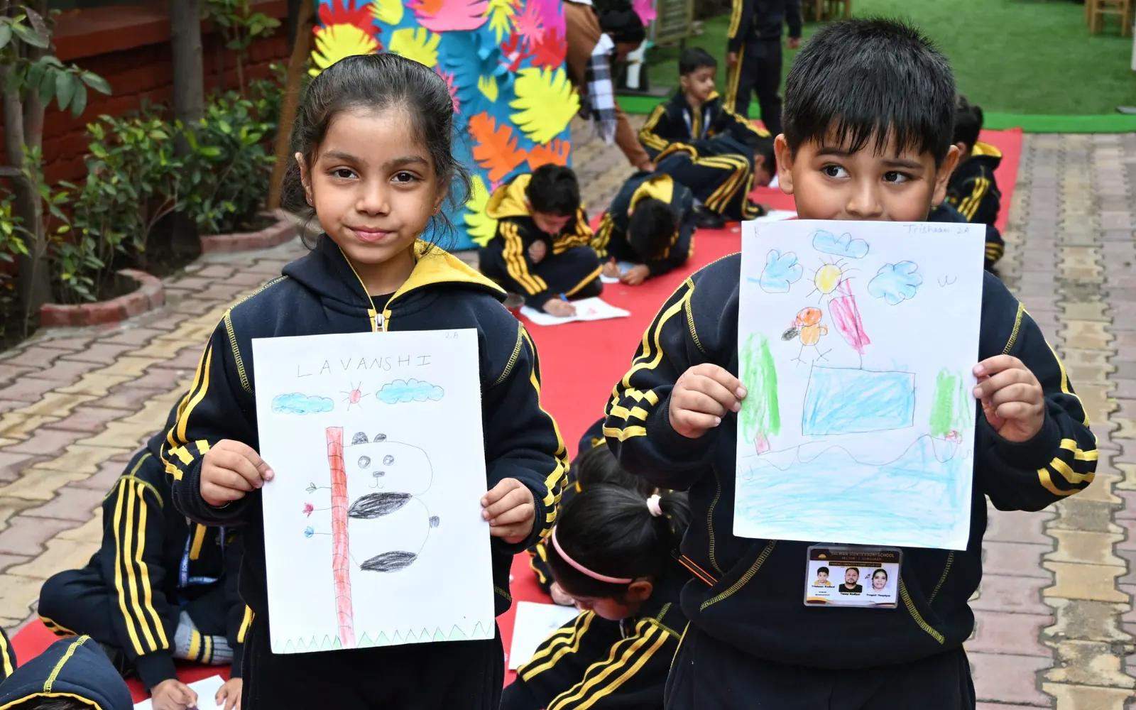 Young artists displaying their drawings