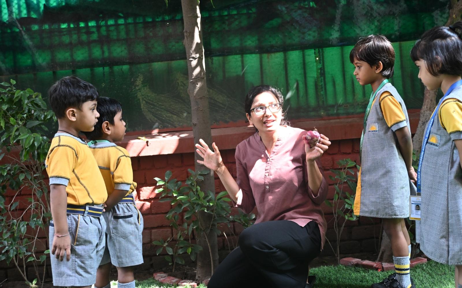 A teacher sharing an outdoor storytelling activity with children