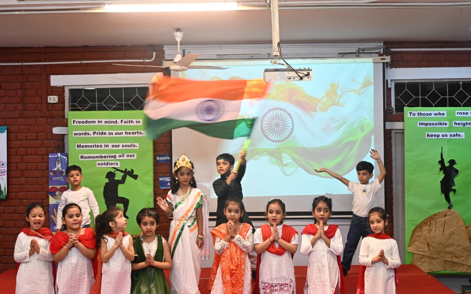 Children presenting a patriotic performance with the Indian flag