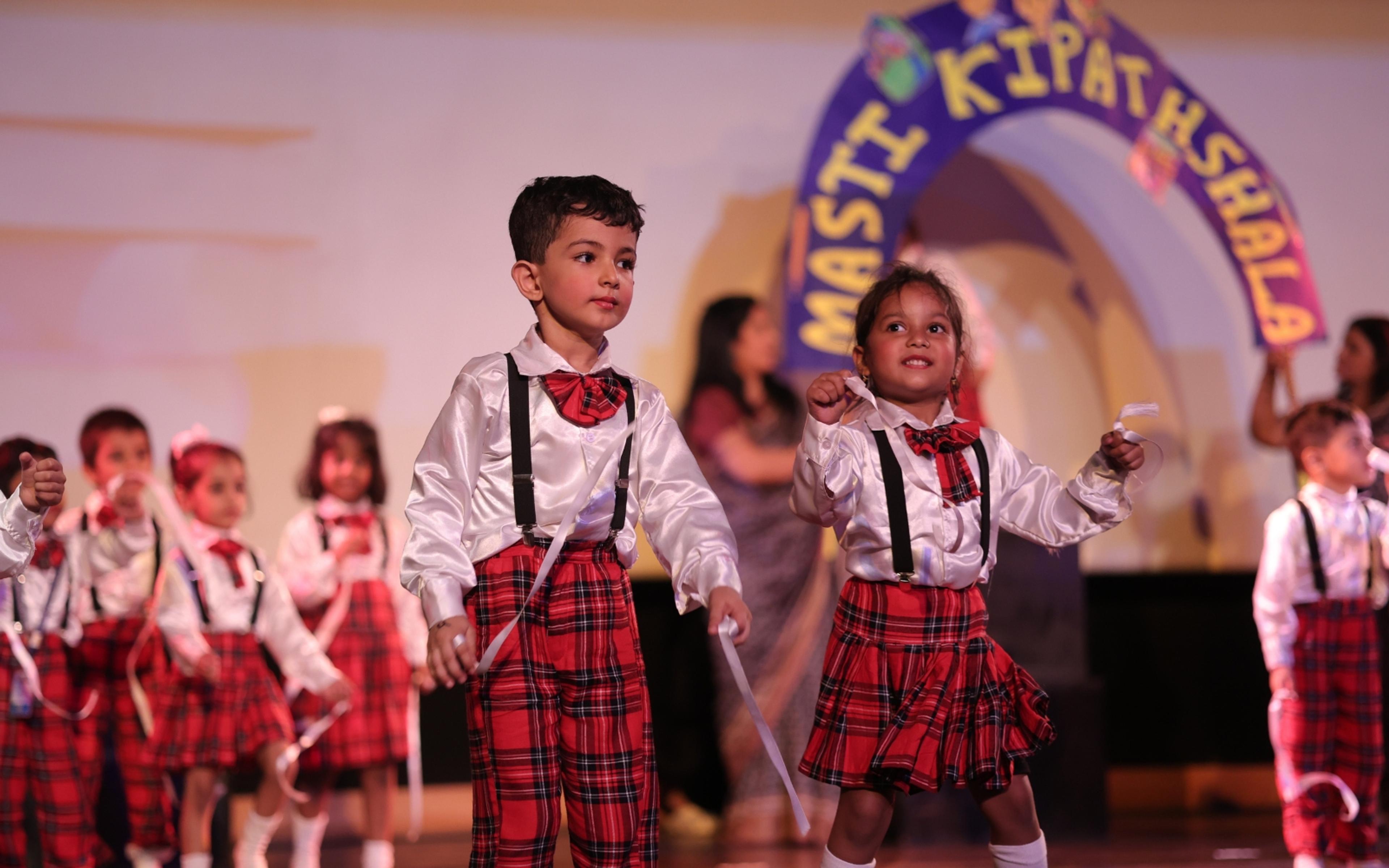Young learners performing together on stage