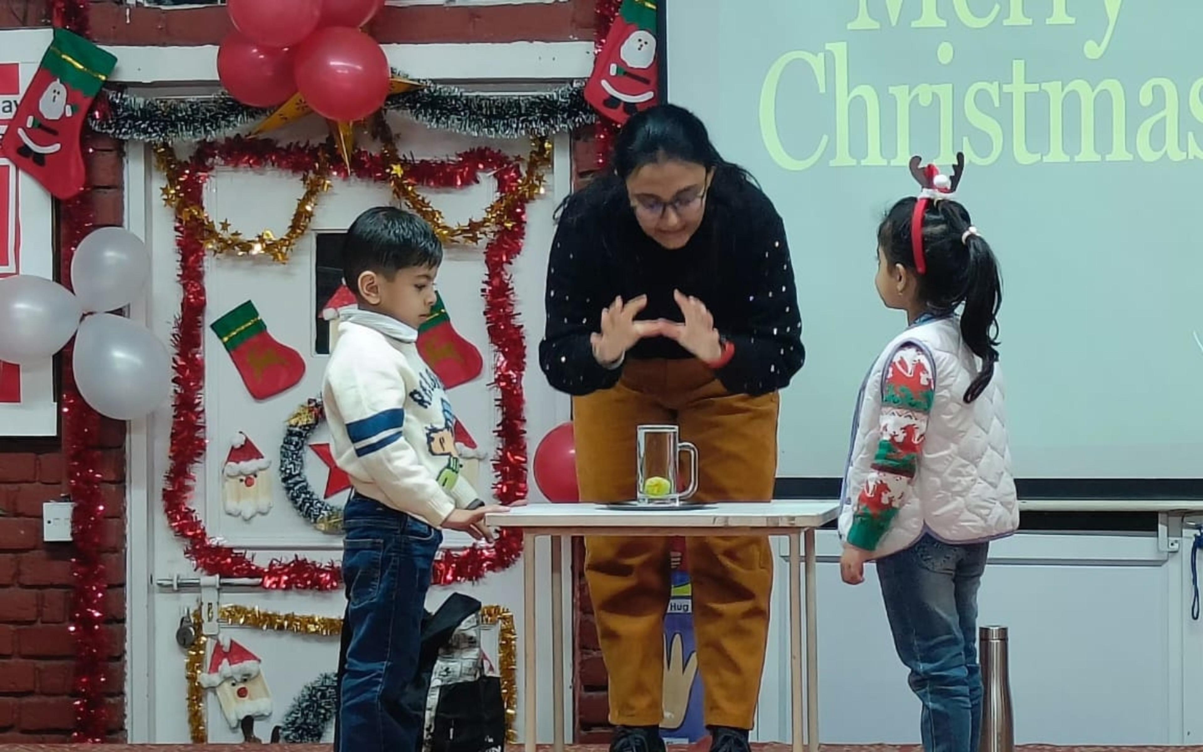 A teacher leading a Christmas-themed classroom activity