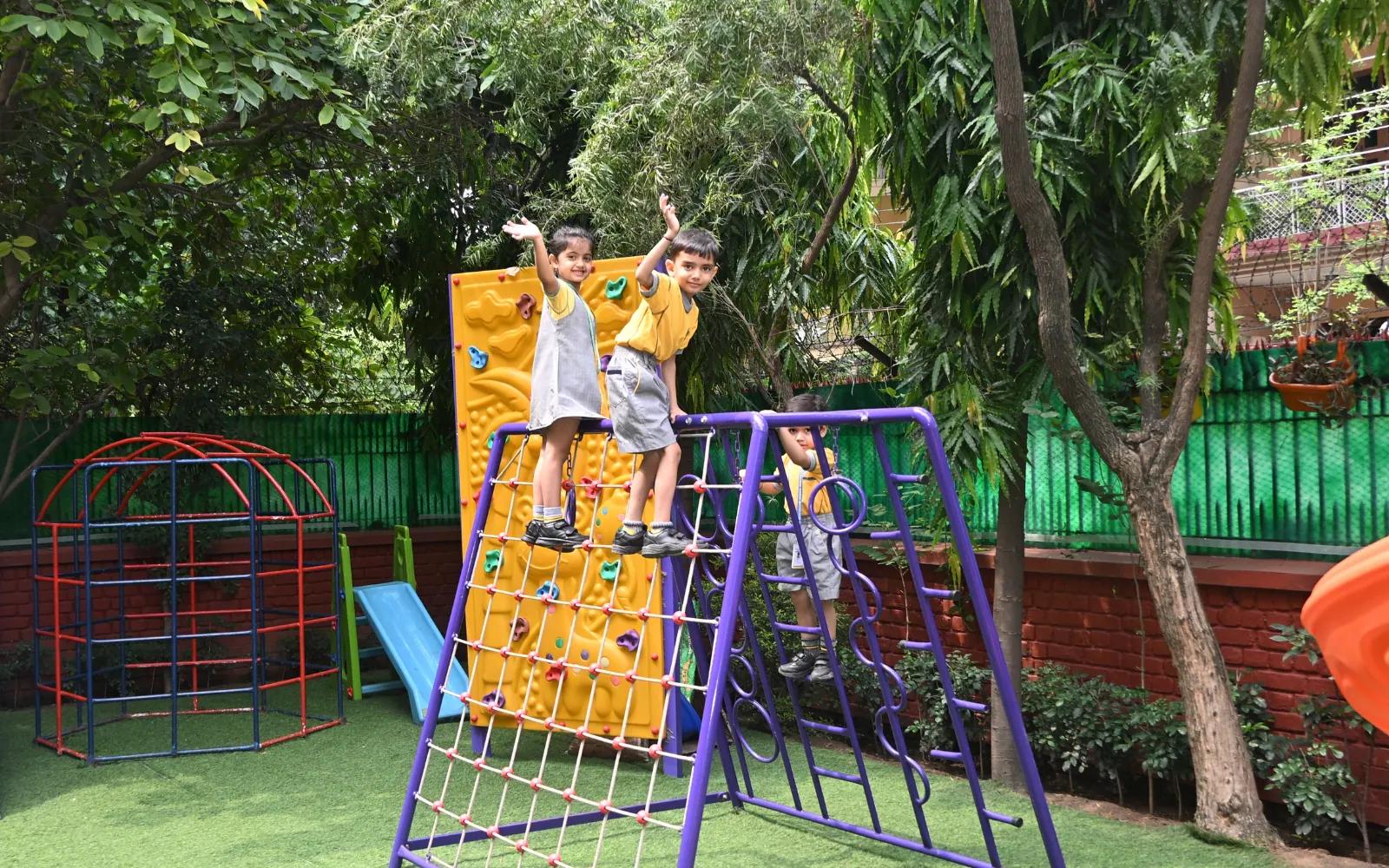 Children exploring the outdoor play equipment