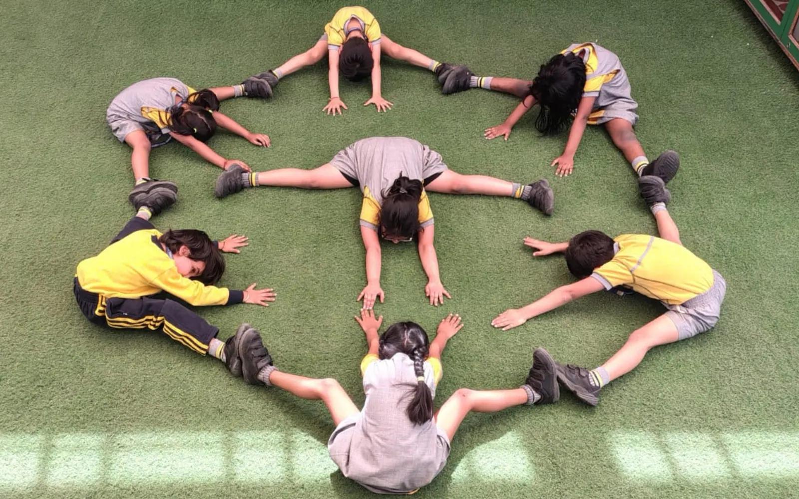 Children forming a shape during physical activity