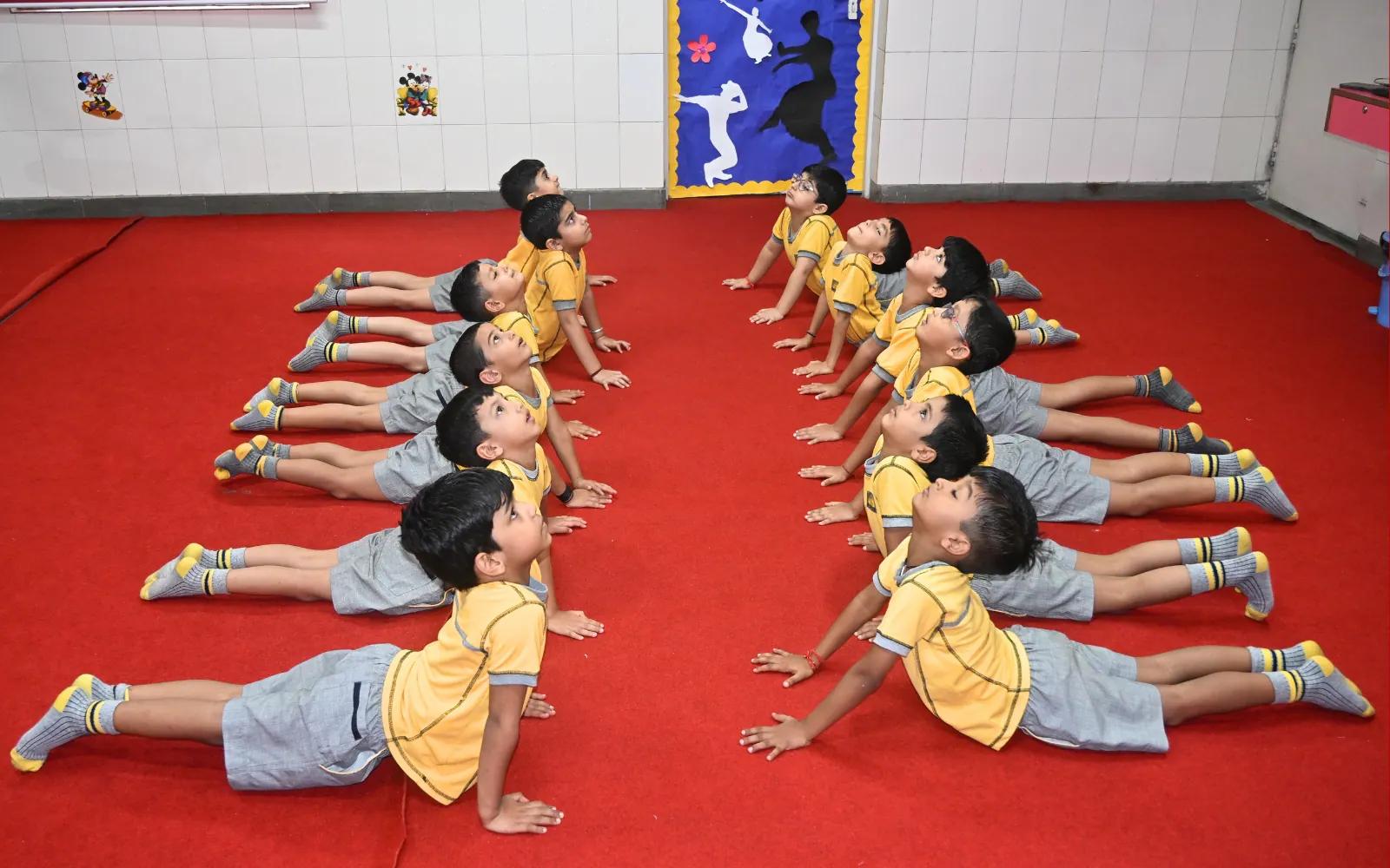 Children practising yoga together