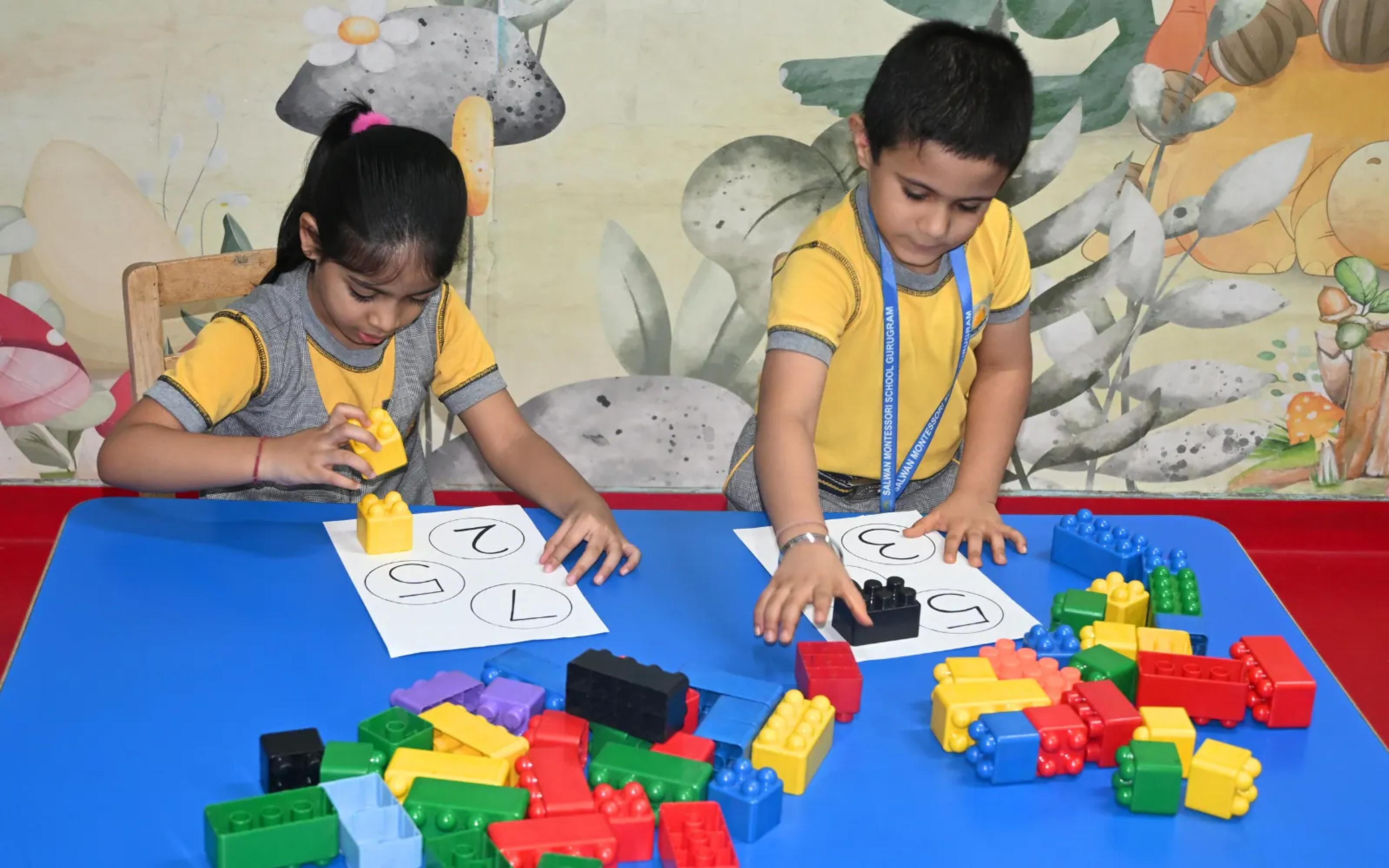 Children building with colourful blocks