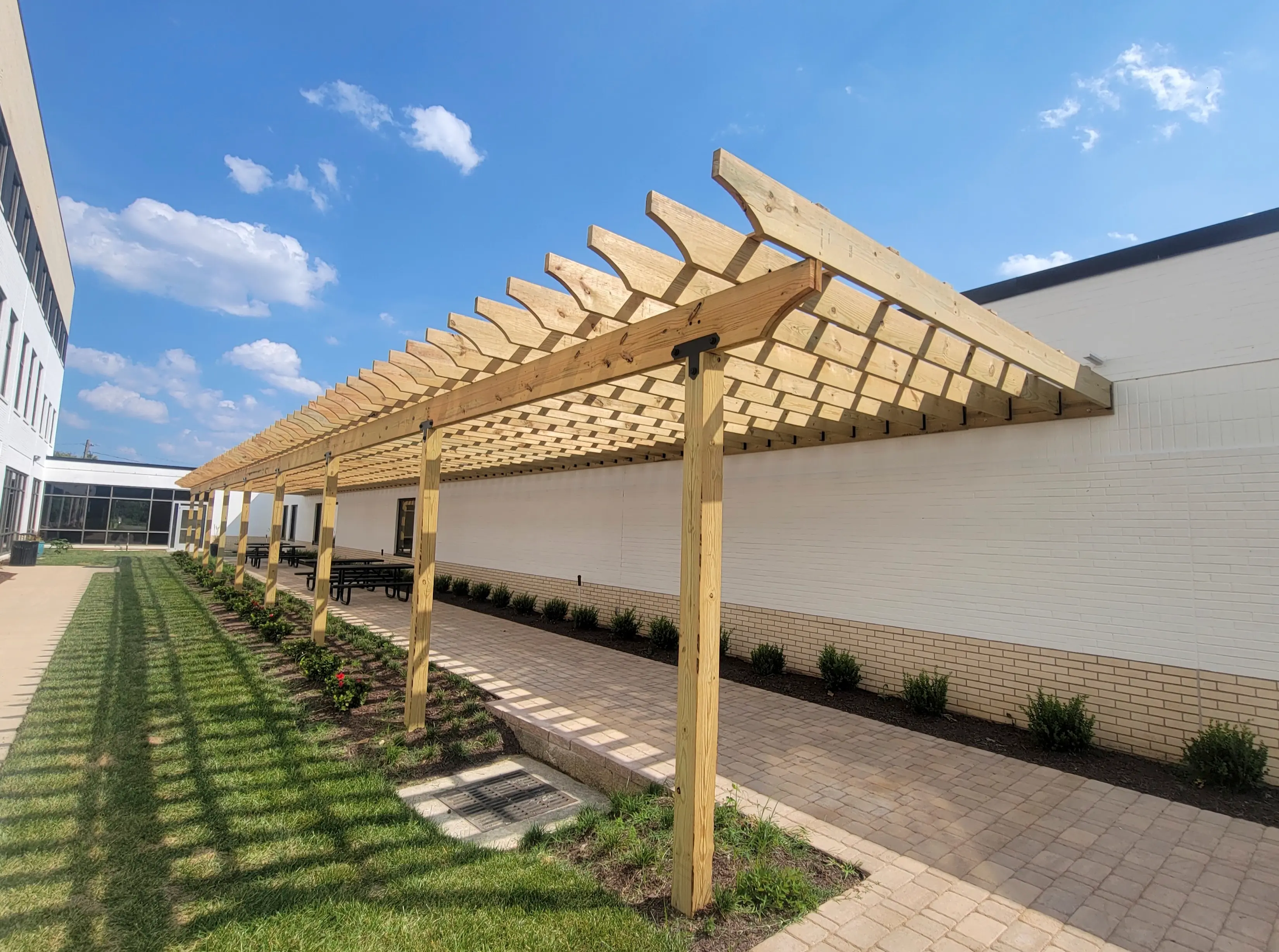A very long pergola in a courtyard at Bon Secours