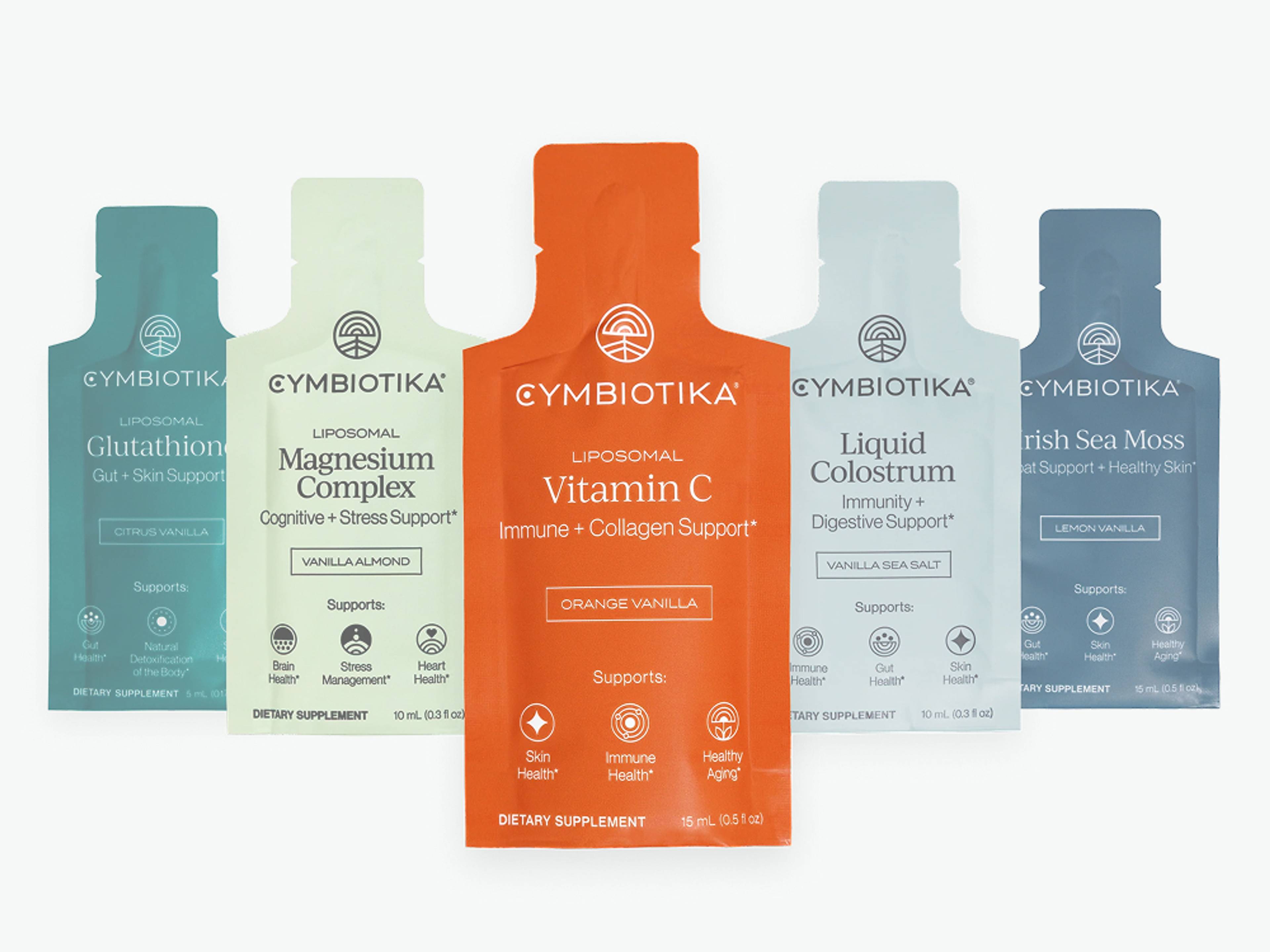 Five Cymbiotika supplement sachets: Glutathione, Magnesium Complex, Vitamin C, Liquid Colostrum, and Irish Sea Moss.