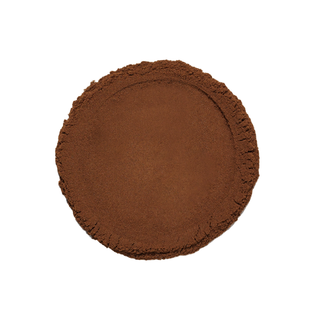 A round mound of fine reddish-brown powder viewed from above.