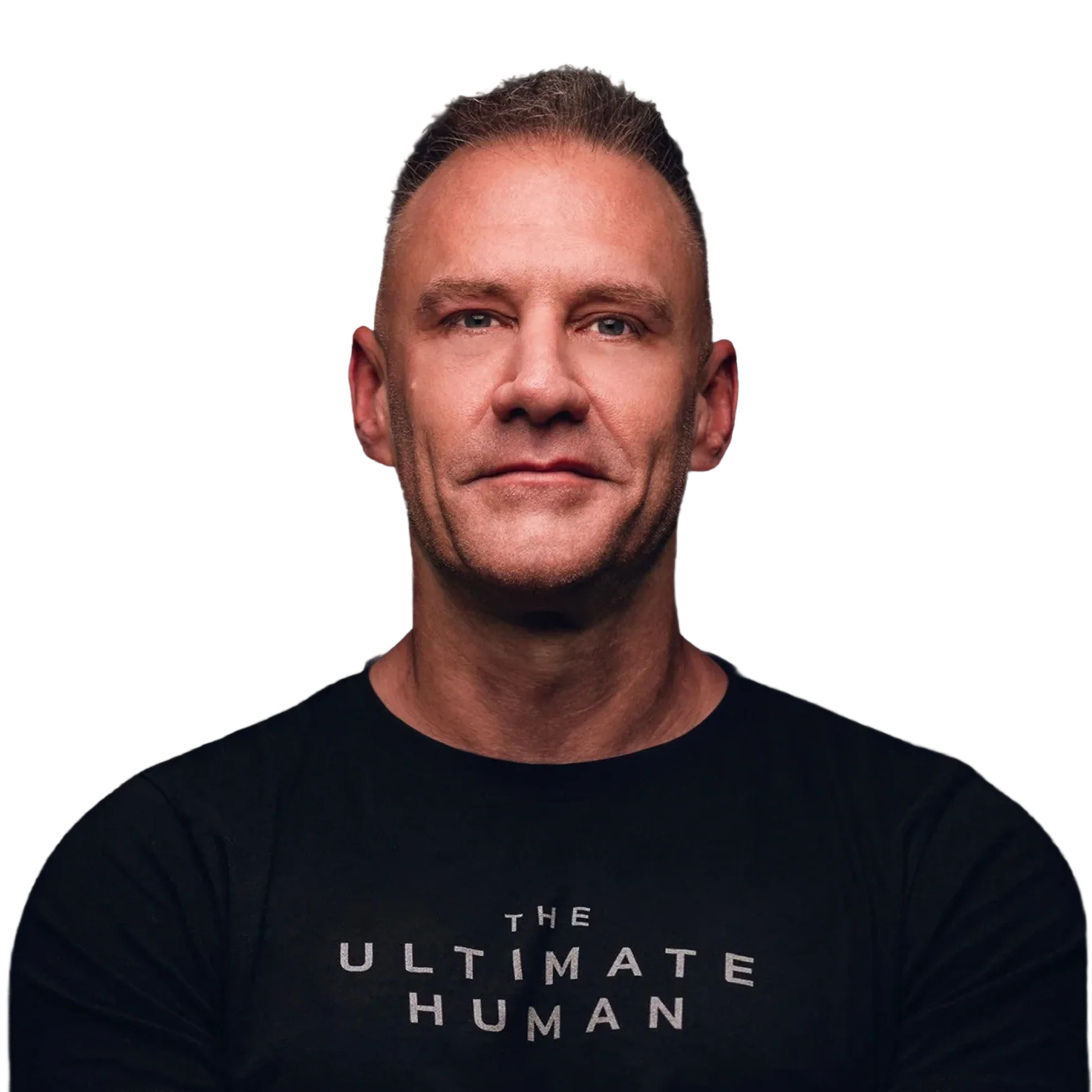A man wearing a black shirt with “THE ULTIMATE HUMAN” lettering.