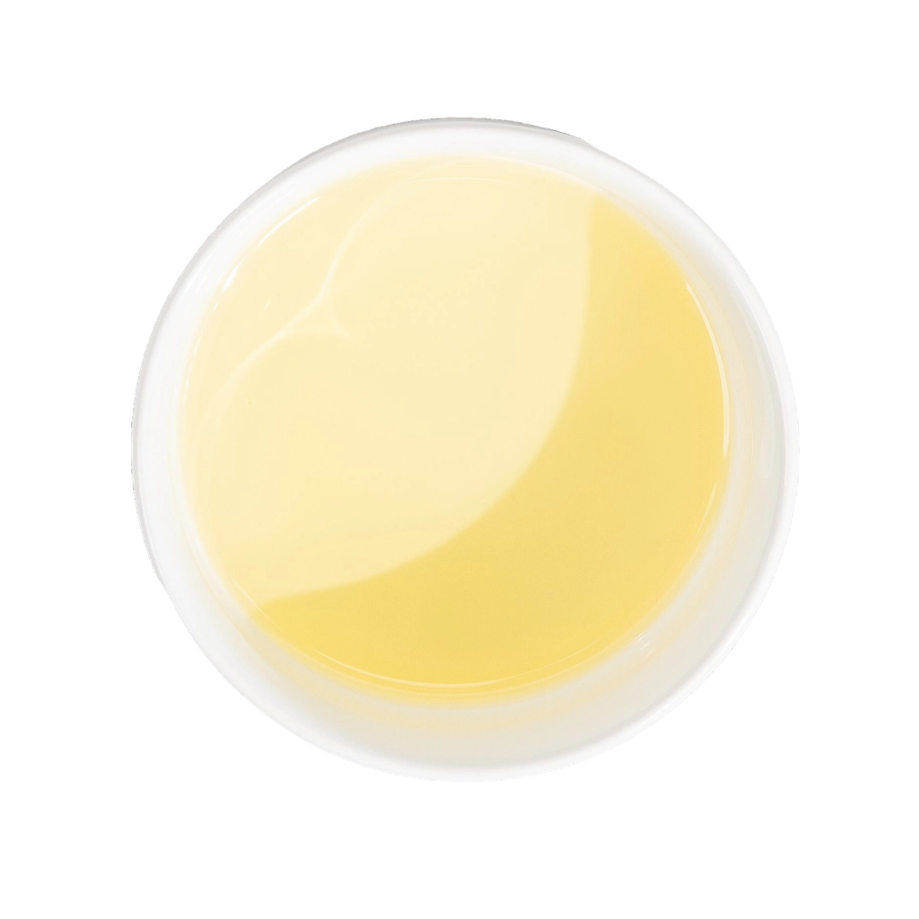 Top-down view of a round dish filled with pale yellow liquid.