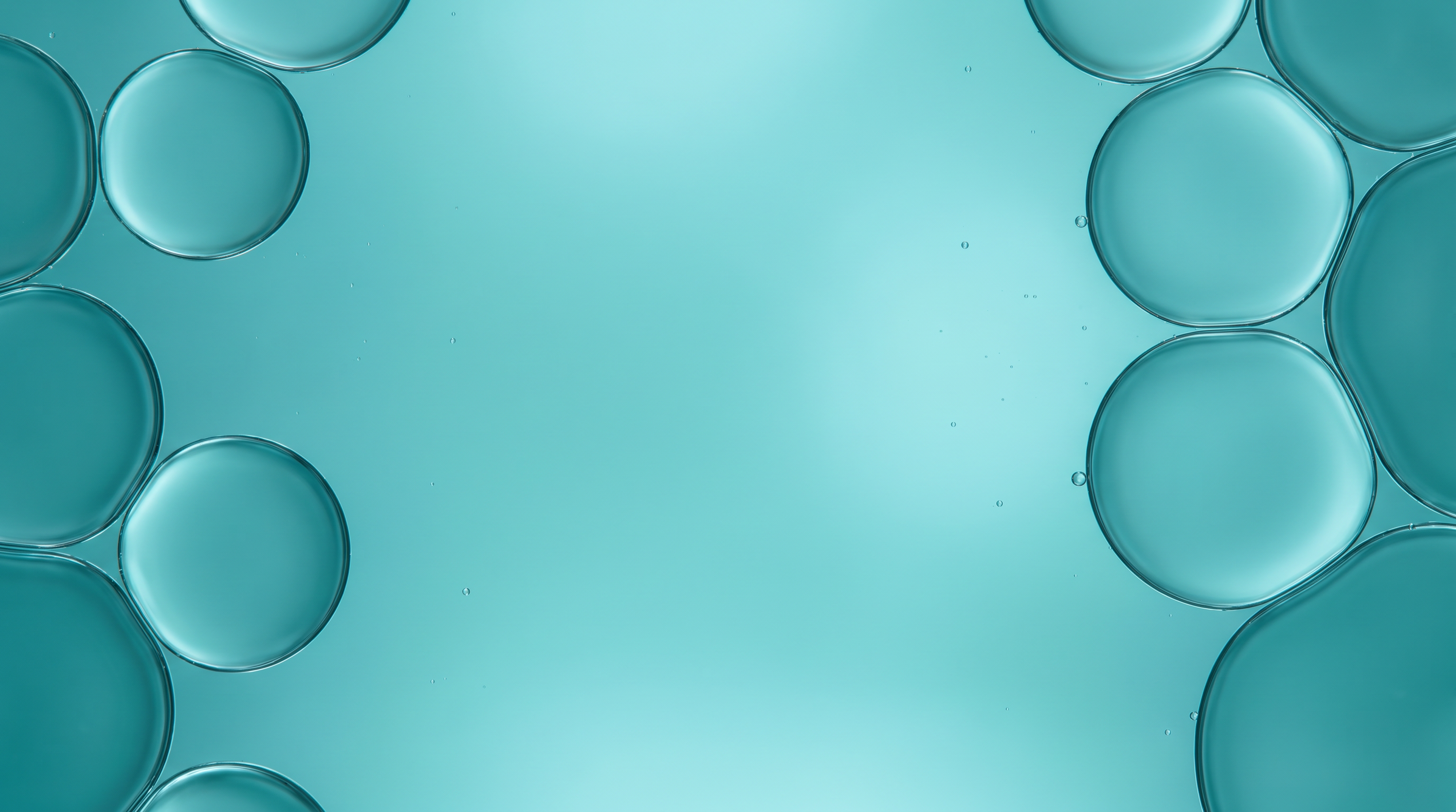 Close-up of translucent teal bubbles against a turquoise background, used as a visual for the Gut Health slide.