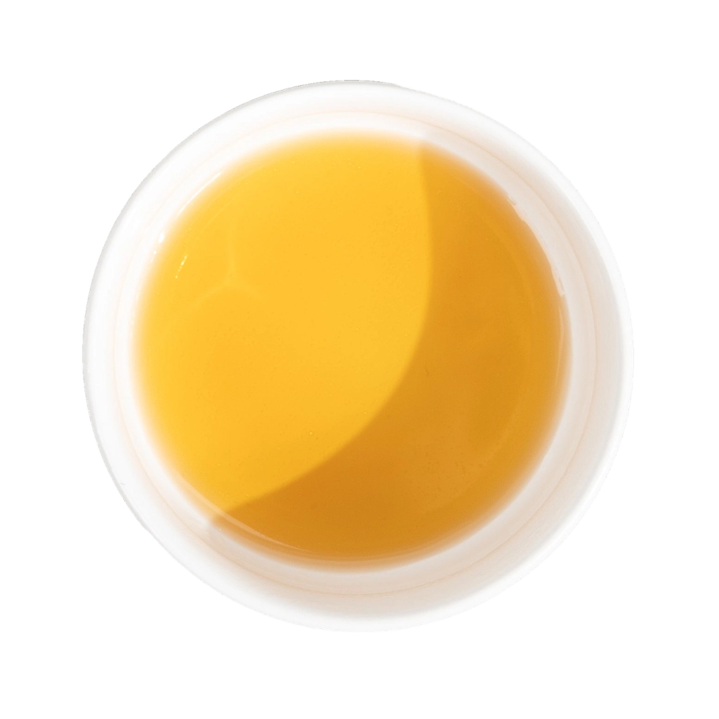 Circular pool of golden-orange liquid with a pale rim, shown from above.