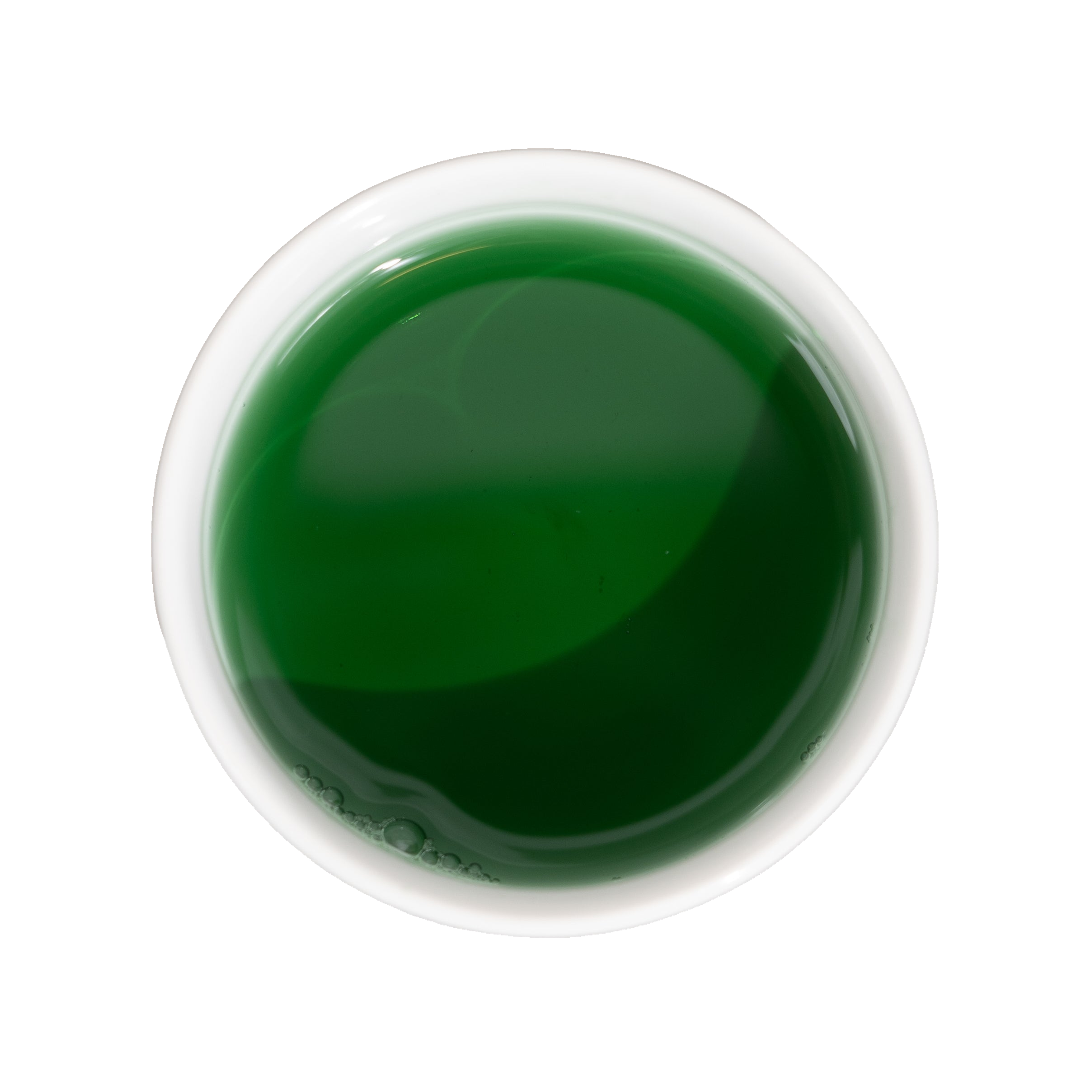Round, pale-rimmed dish filled with dark green liquid.
