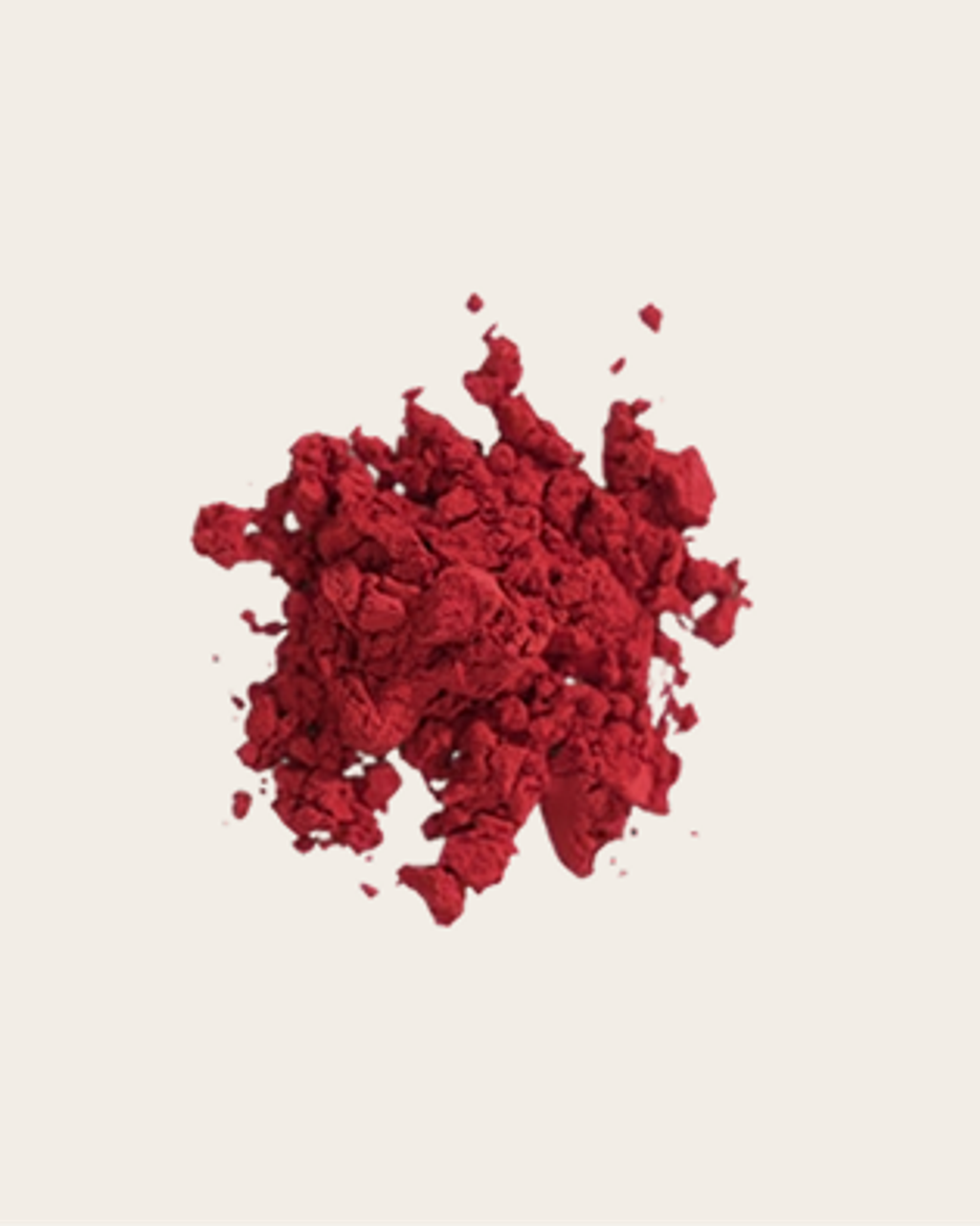 Pile of deep red, irregular fragments with scattered small pieces.