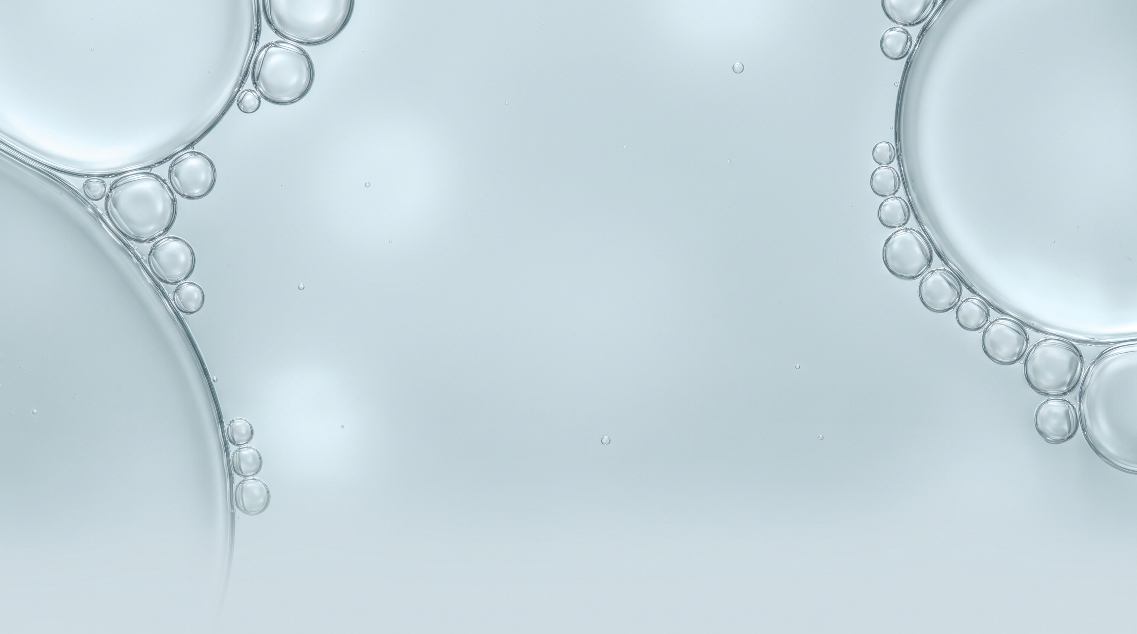 Translucent bubble-like circles against a pale blue background.
