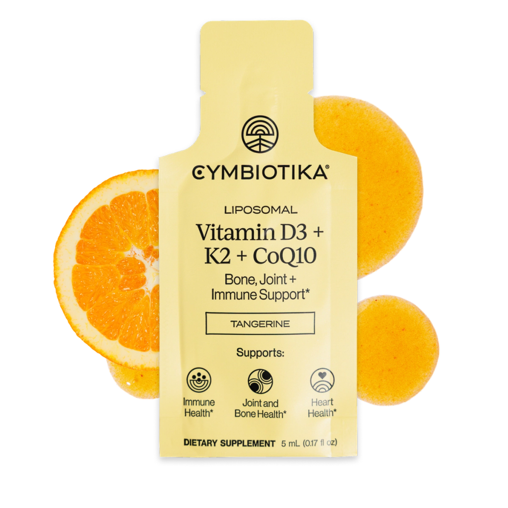 Yellow Cymbiotika Liposomal Vitamin D3 + K2 + CoQ10 sachet with orange slices; package lists tangerine flavor and support icons.