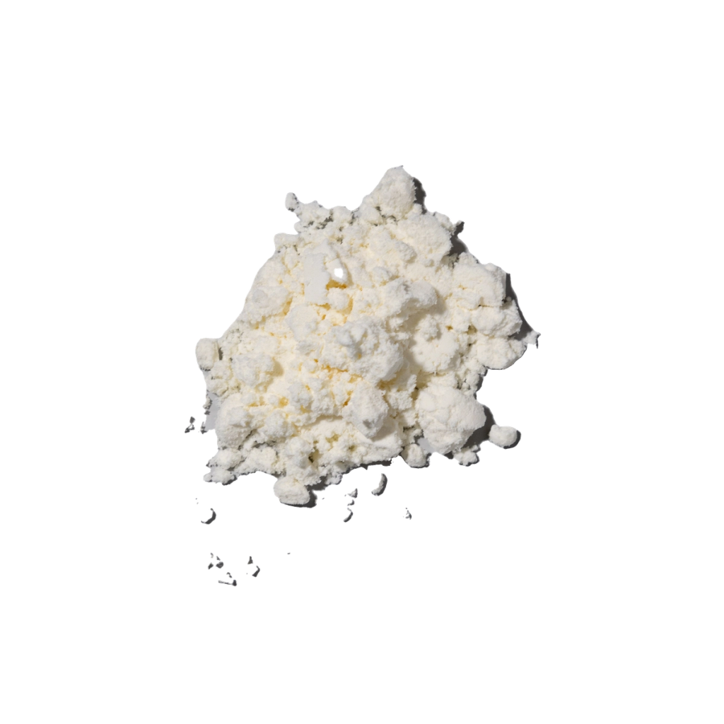 A pale, irregular clump of powder-like material.
