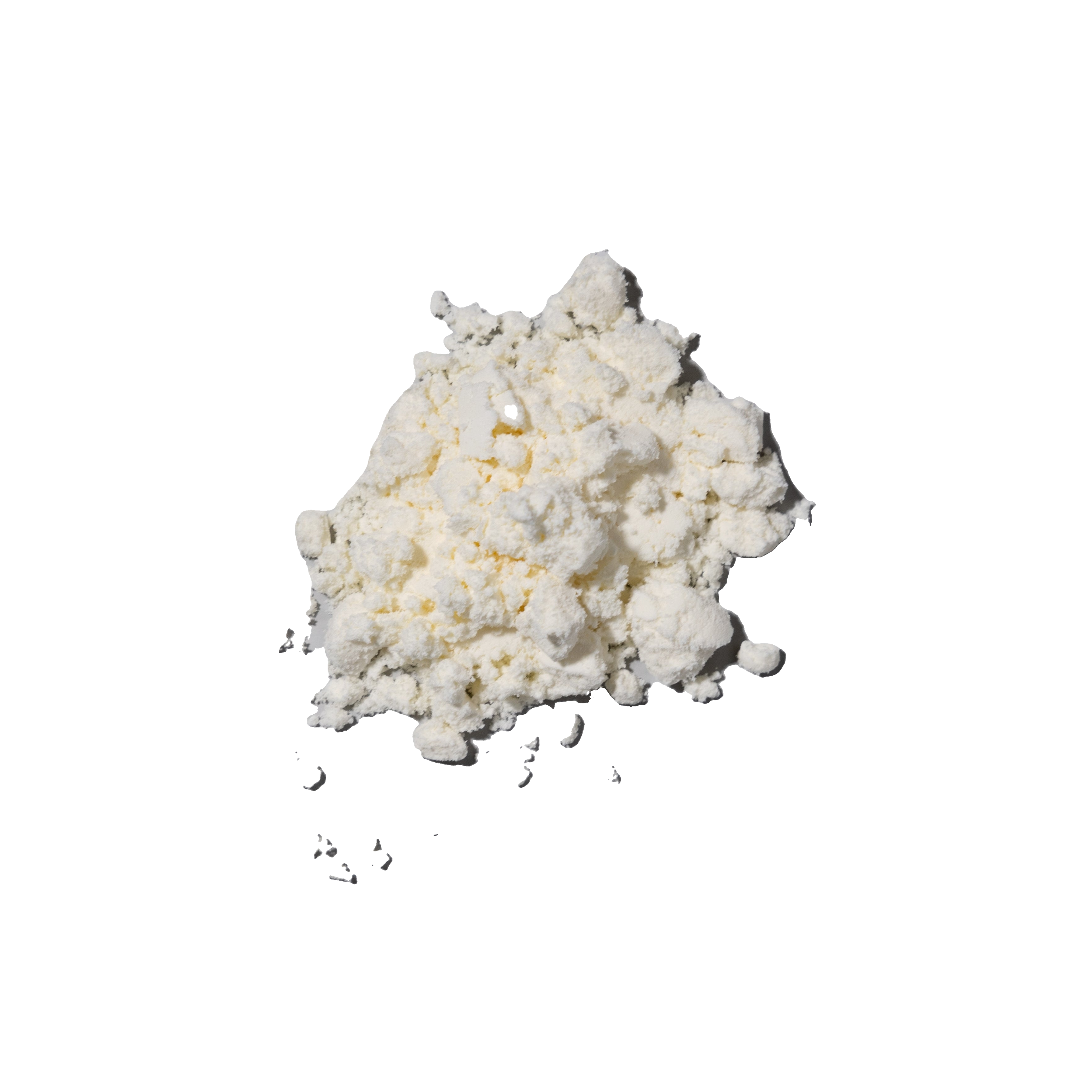 A pale, irregular clump of powder-like material.