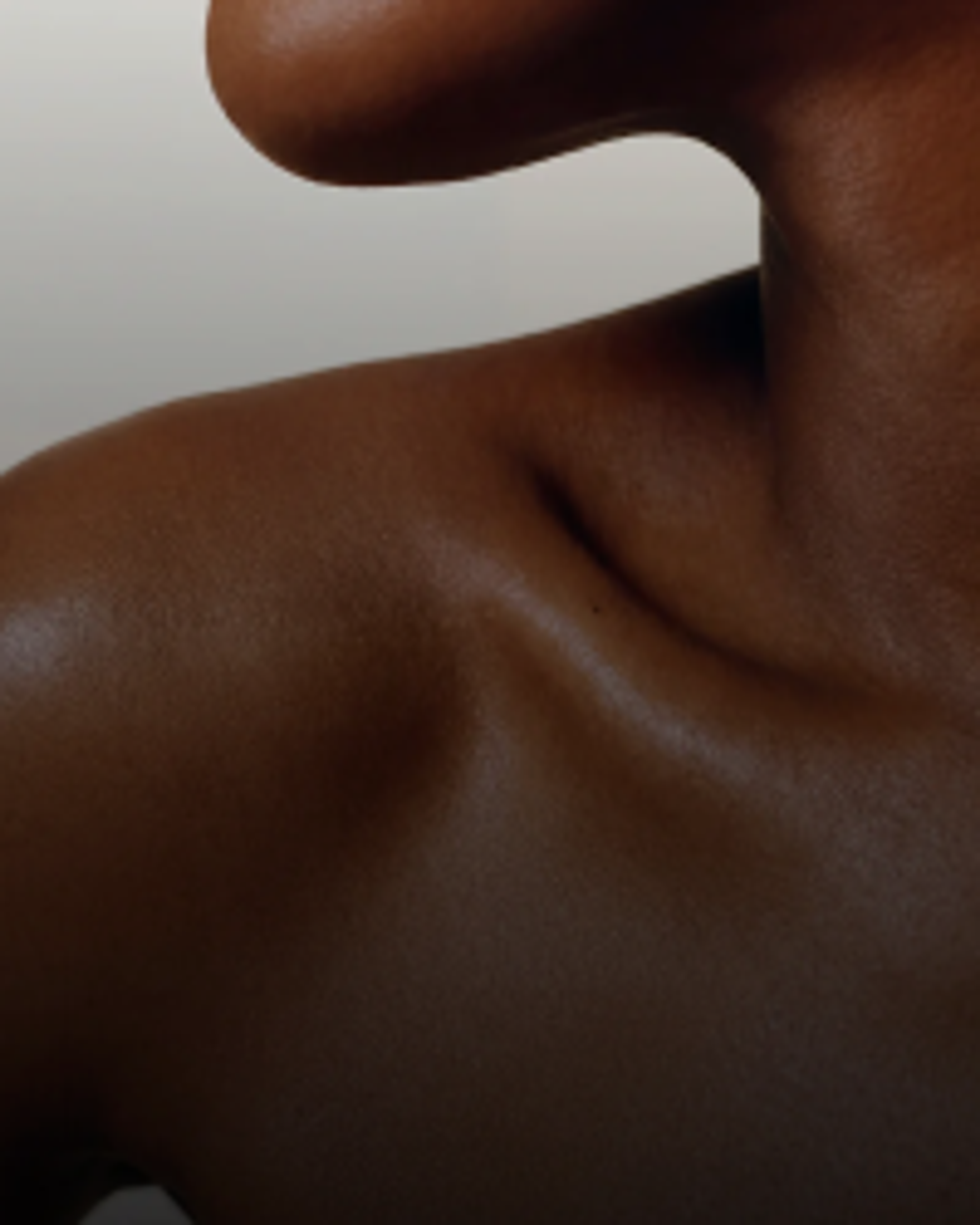 Close-up of a person's shoulder and neck