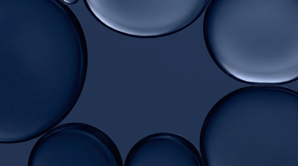 Overlapping dark blue, rounded bubble-like forms in an abstract illustration.