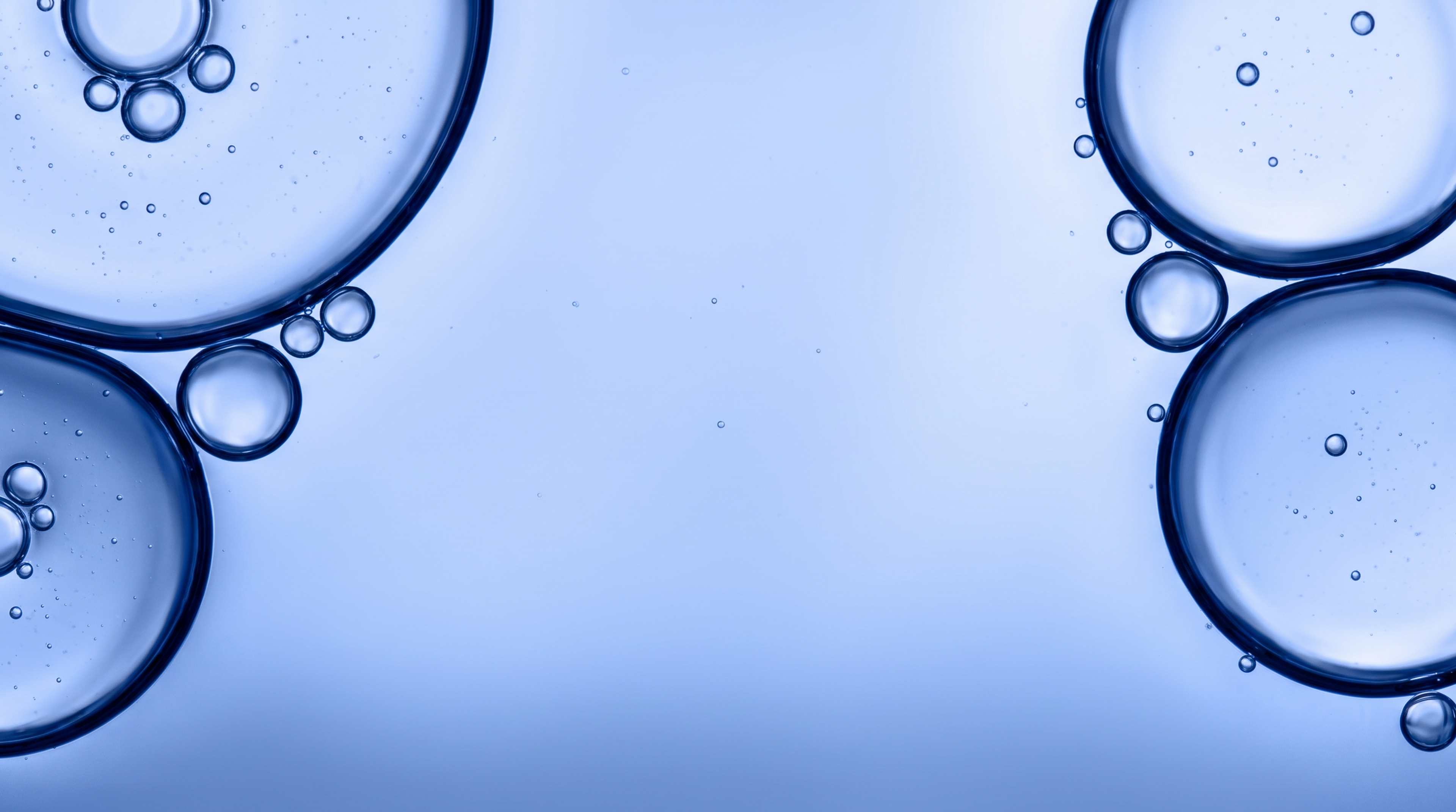 Blue abstract background with outlined bubbles clustered around the edges.