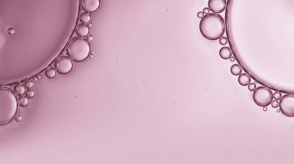 Abstract pink liquid bubbles, used as a visual for the Recovery supplement category.