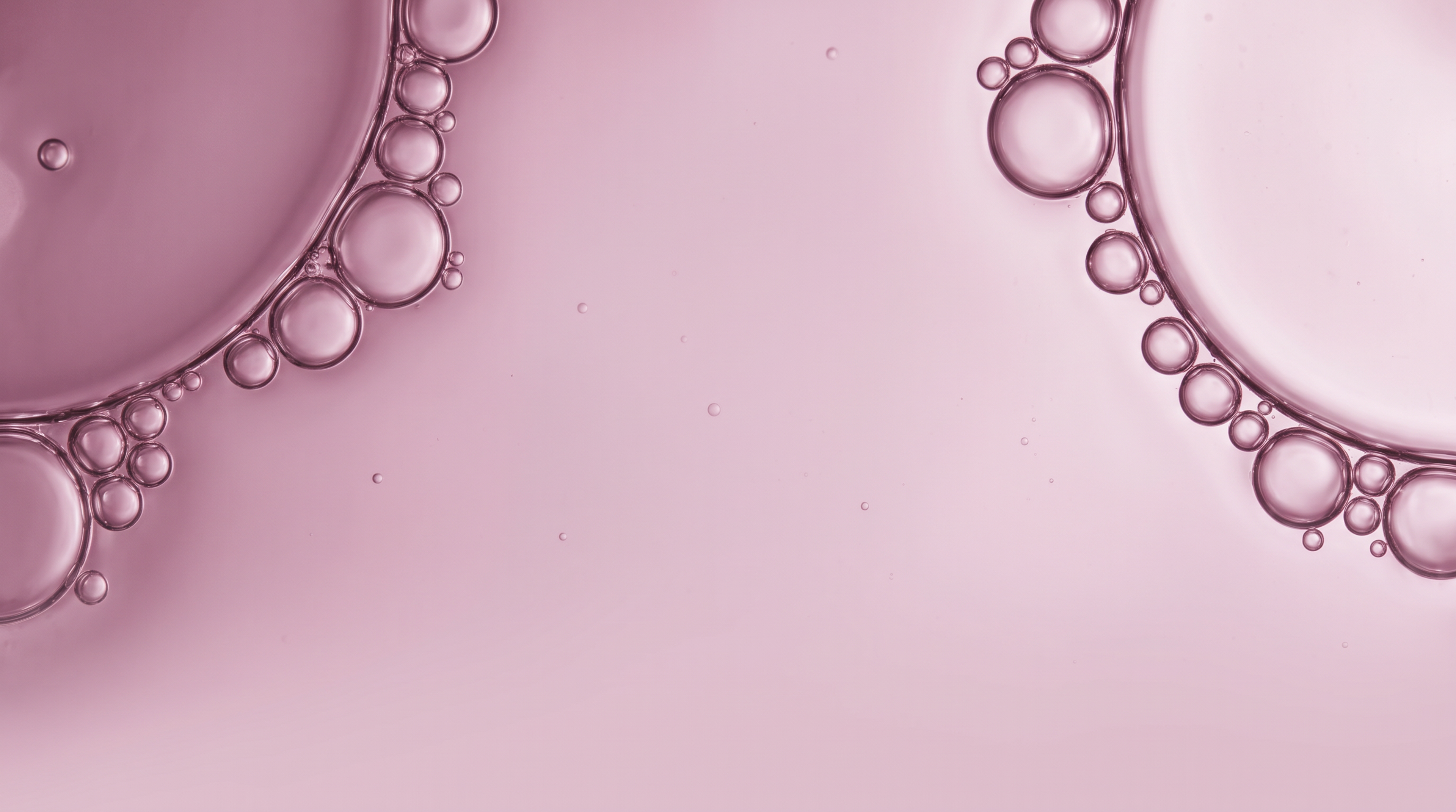 Abstract pink liquid bubbles, used as a visual for the Recovery supplement category.