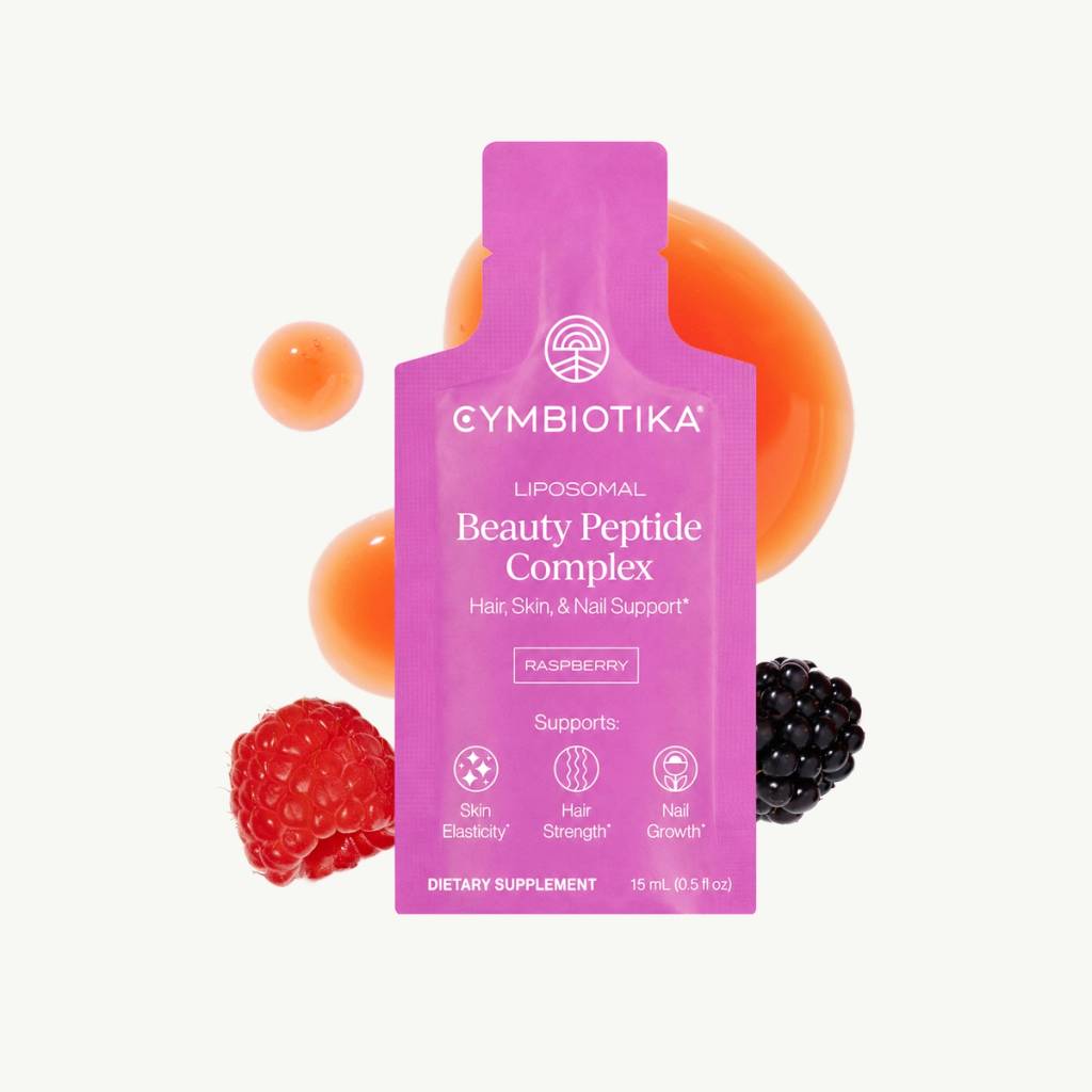 Pink Cymbiotika Liposomal Beauty Peptide Complex packet with raspberries and blackberries.