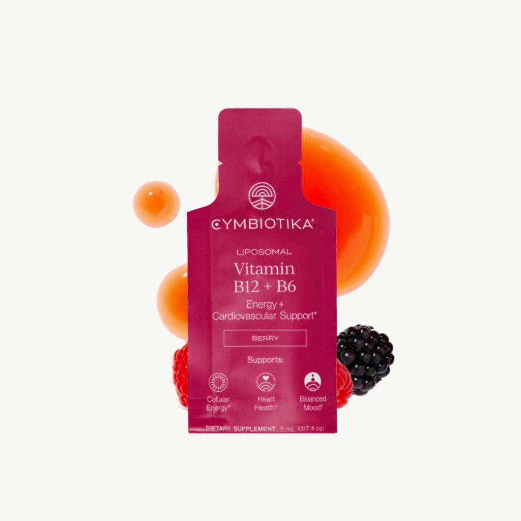 Magenta Liposomal Vitamin B12 + B6 packet with orange spheres and berries behind it.
