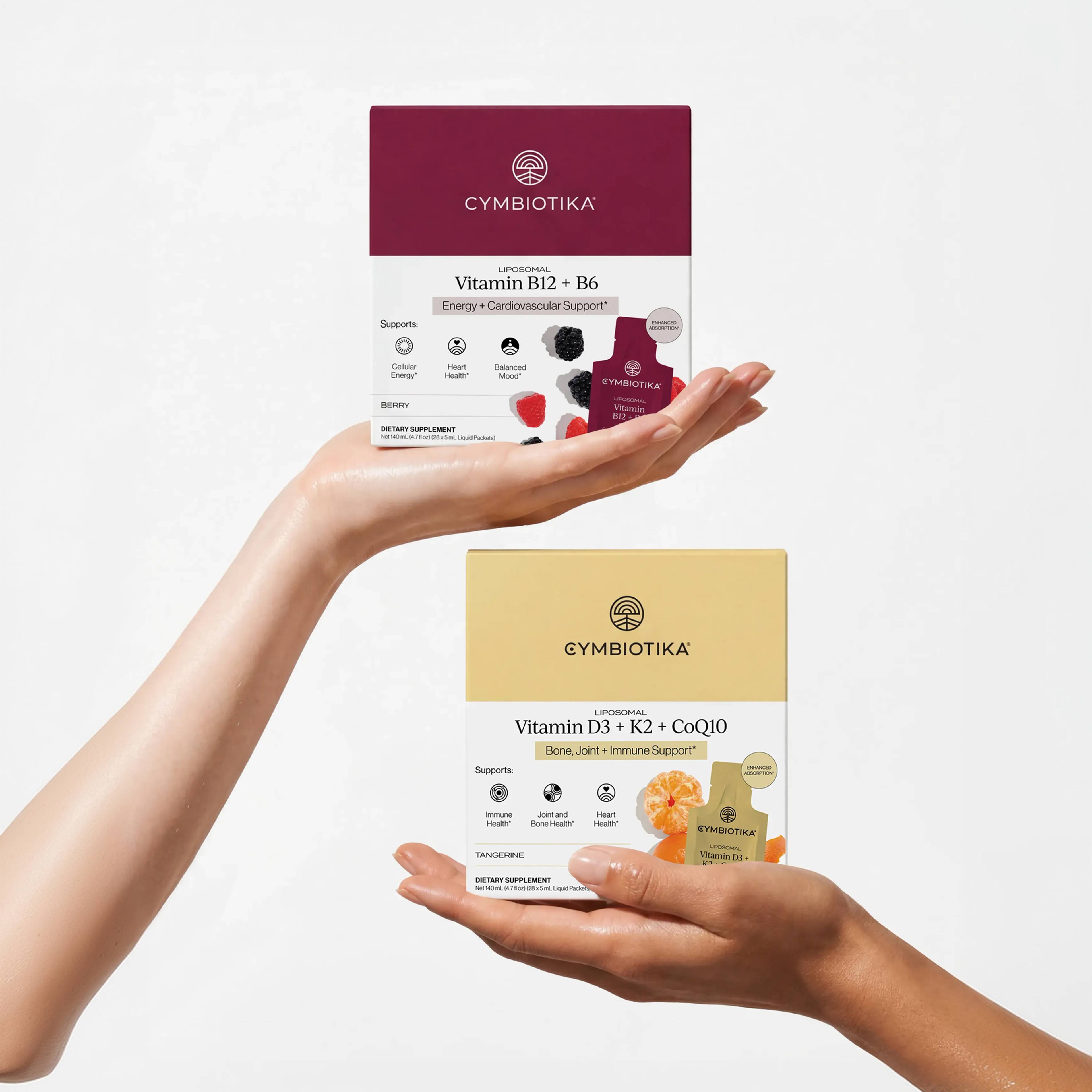 Hands present boxes of Liposomal Vitamin B12 + B6 and Liposomal Vitamin D3 + K2 + CoQ10.