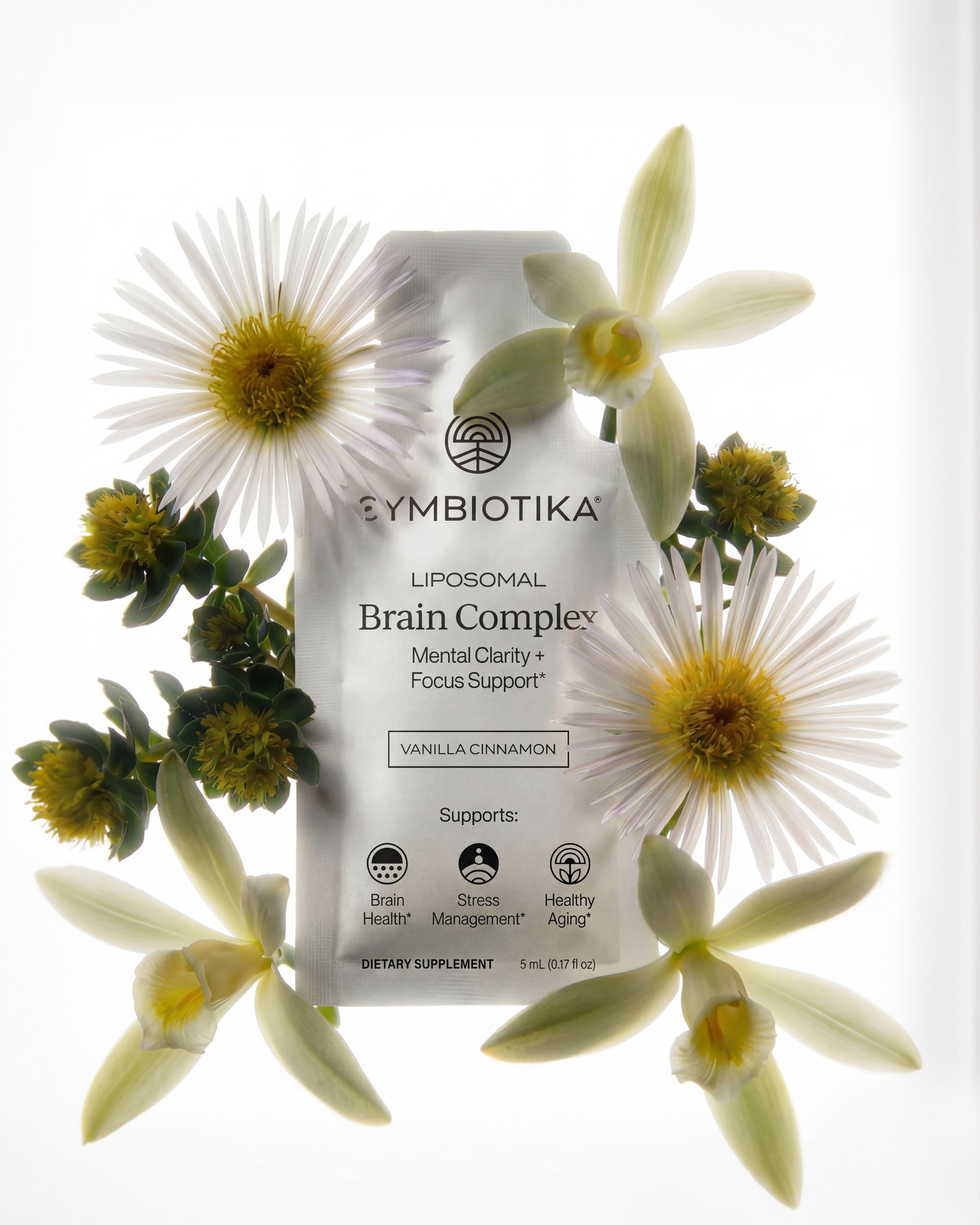 Liposomal Brain Complex pouch surrounded by white and yellow flowers, with vanilla cinnamon flavor and support icons on the label.