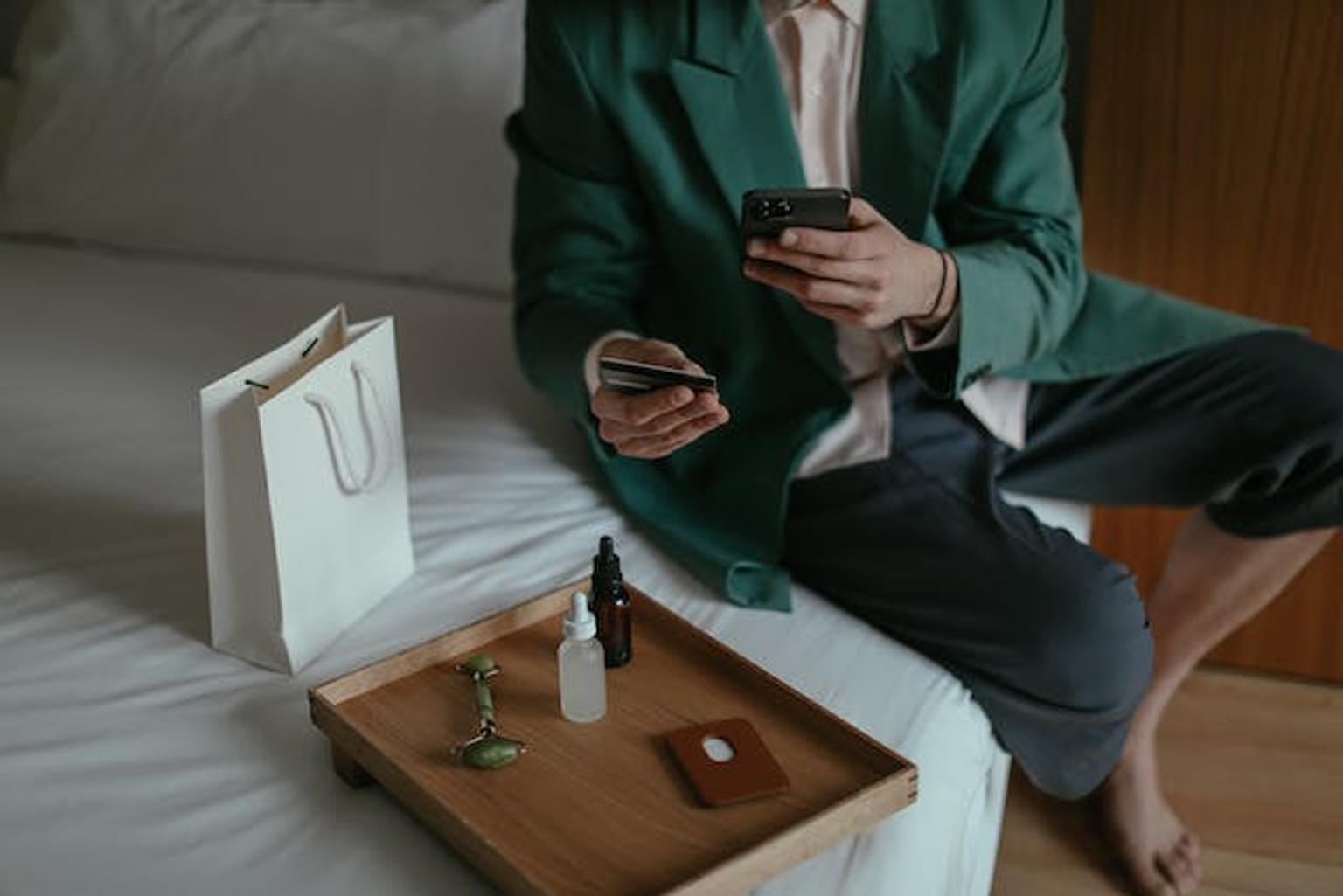 Women adding credit card details for online purchase