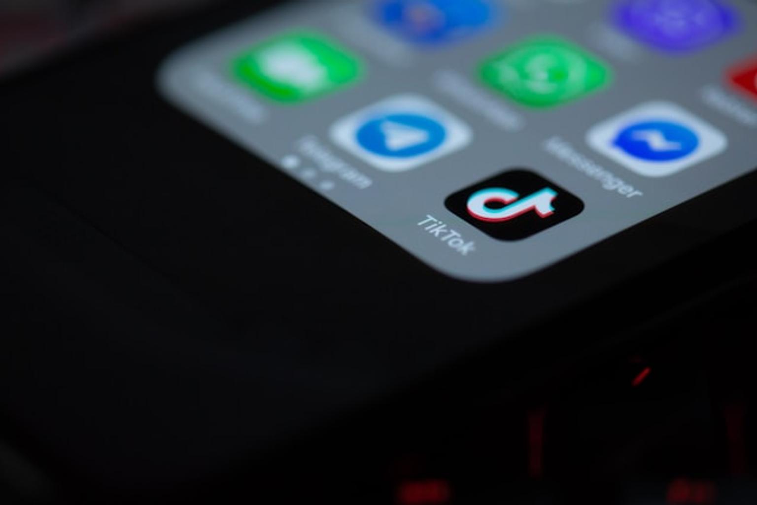 Image of a smartphone with TikTok app on the home screen