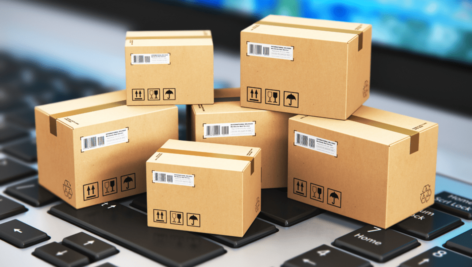 Image of shipment boxes placed on a laptop implying eCommerce