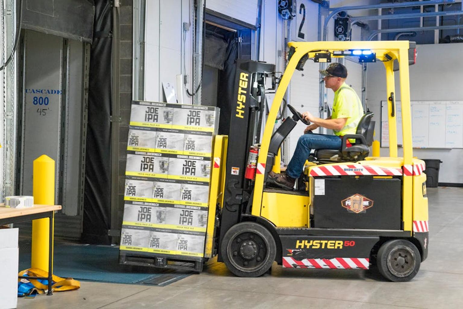 Image of a forklift operator in a prep center