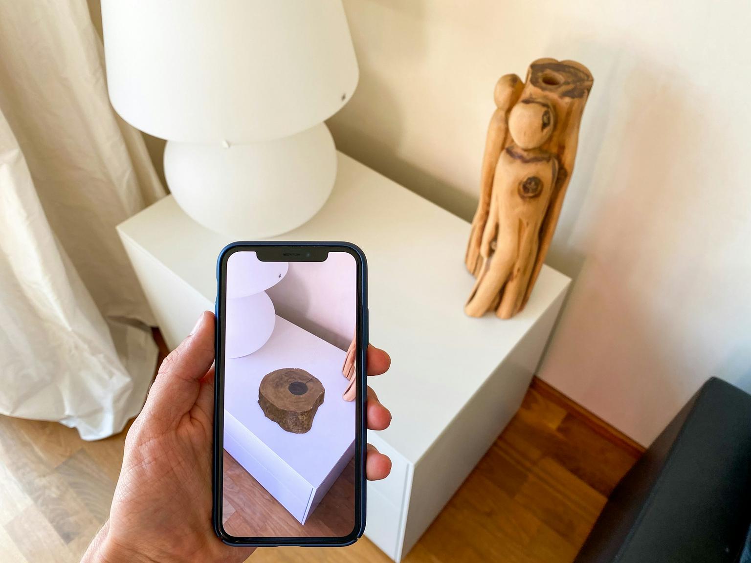 Person planning decoration shopping with AR.