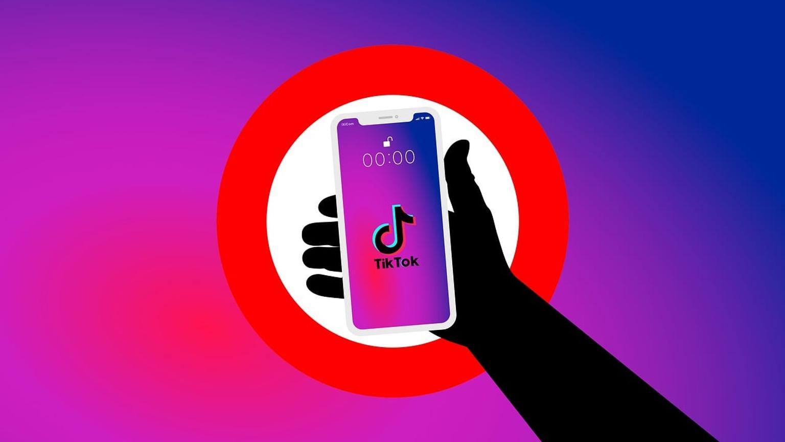 Illustration of a hand holding a smartphone with TikTok against a stop sign