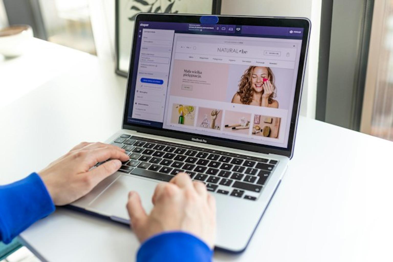 Person managing an online store on a laptop.