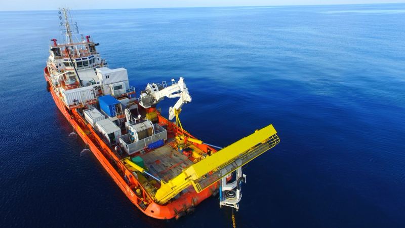 Offshore support vessel working at sea