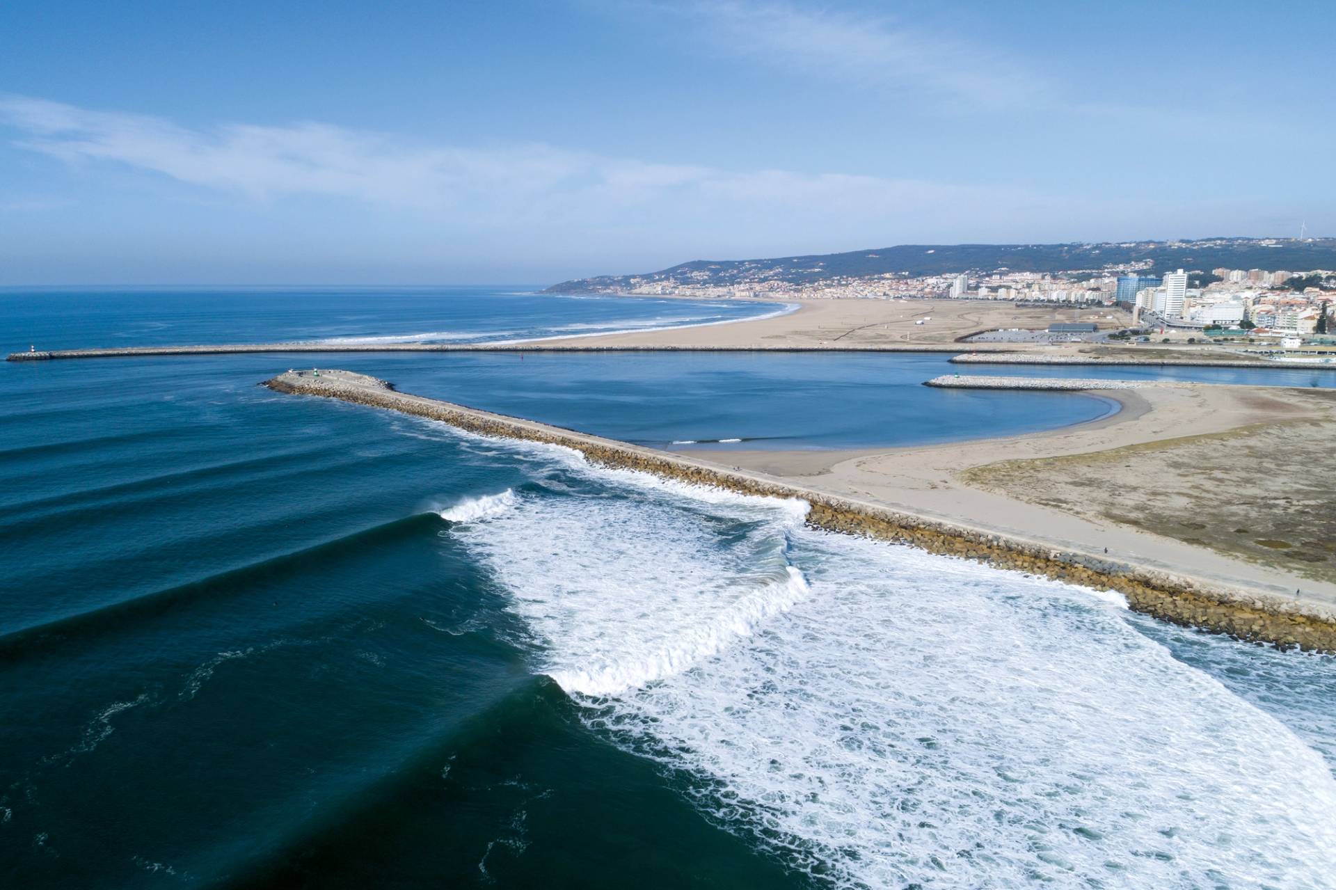 Coastal armouring against erosion is often ineffective and likely to cause further problems for adjacent coastlines, but jetties, groynes and harbour walls can also create some perfect surfing real estate. Figuera da Foz, Portugal. by Ricardo Bravo