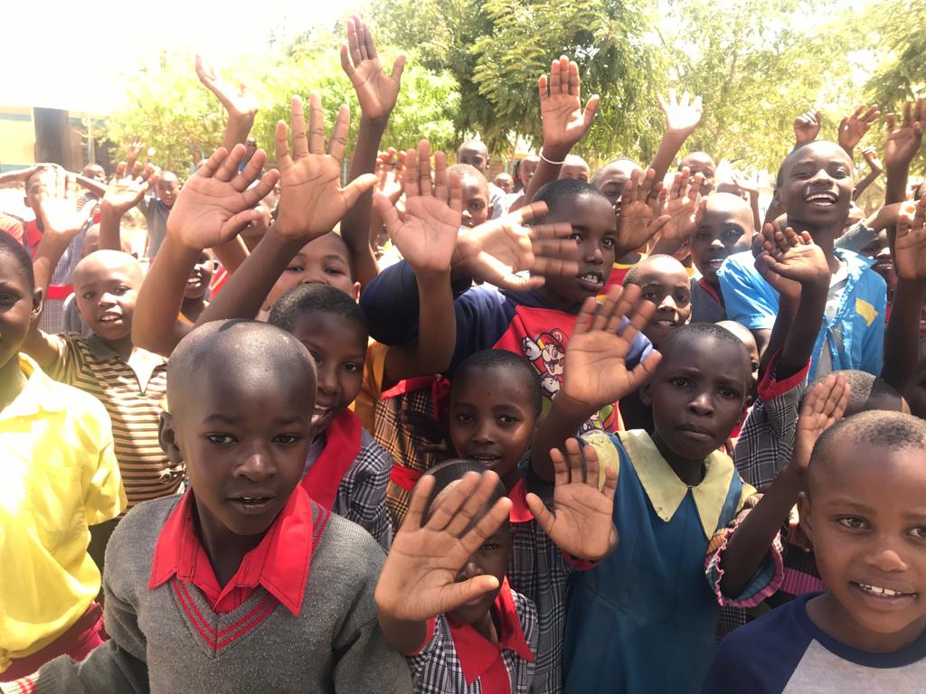 children raising their hands