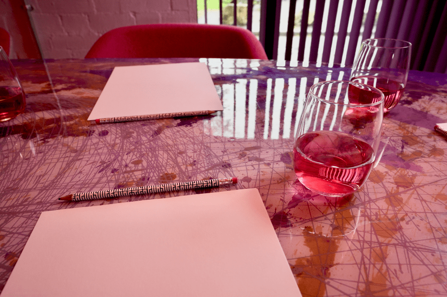 Meeting room table with notepads and refreshments