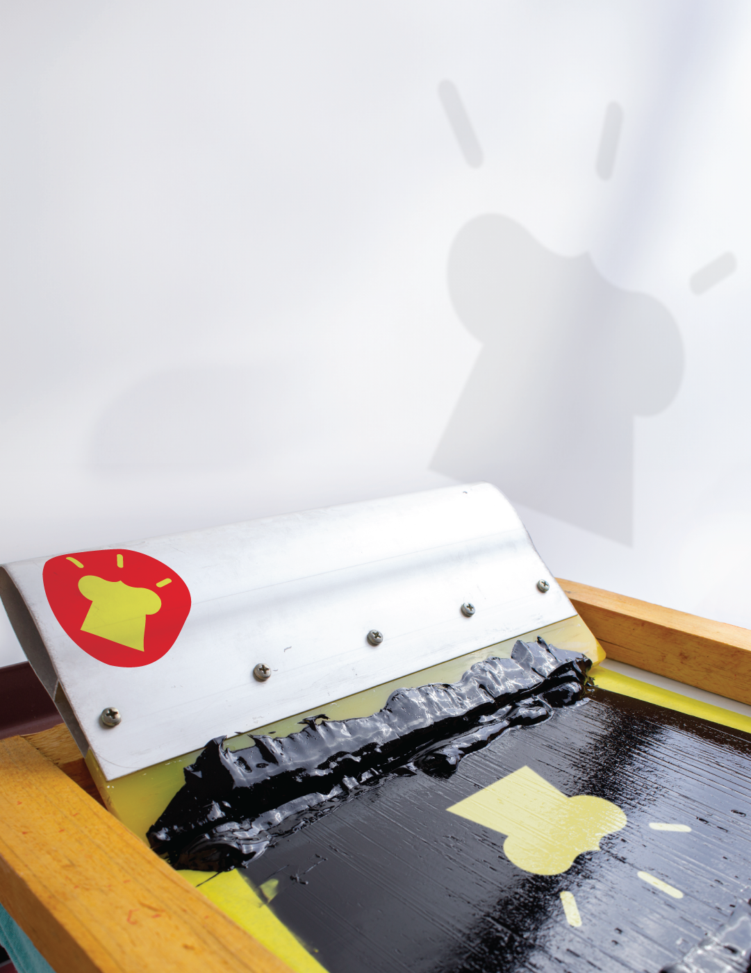 Black pain with a yellow logo mark