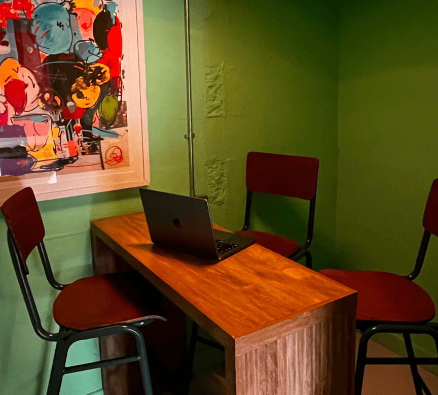 Green room with high chairs and wooden bench