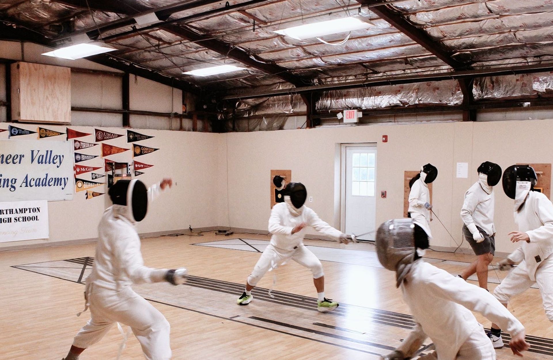 SCA fencing athletes in competition
