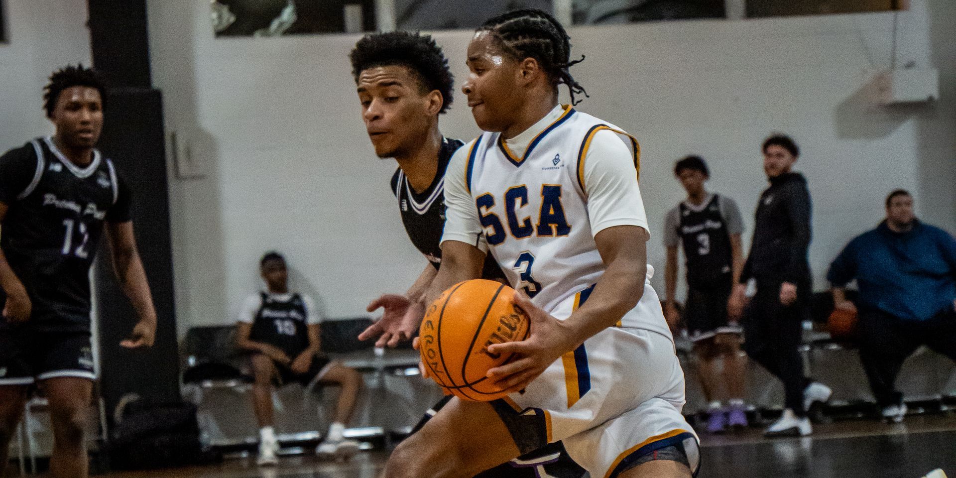 SCA basketball players competing in a home game