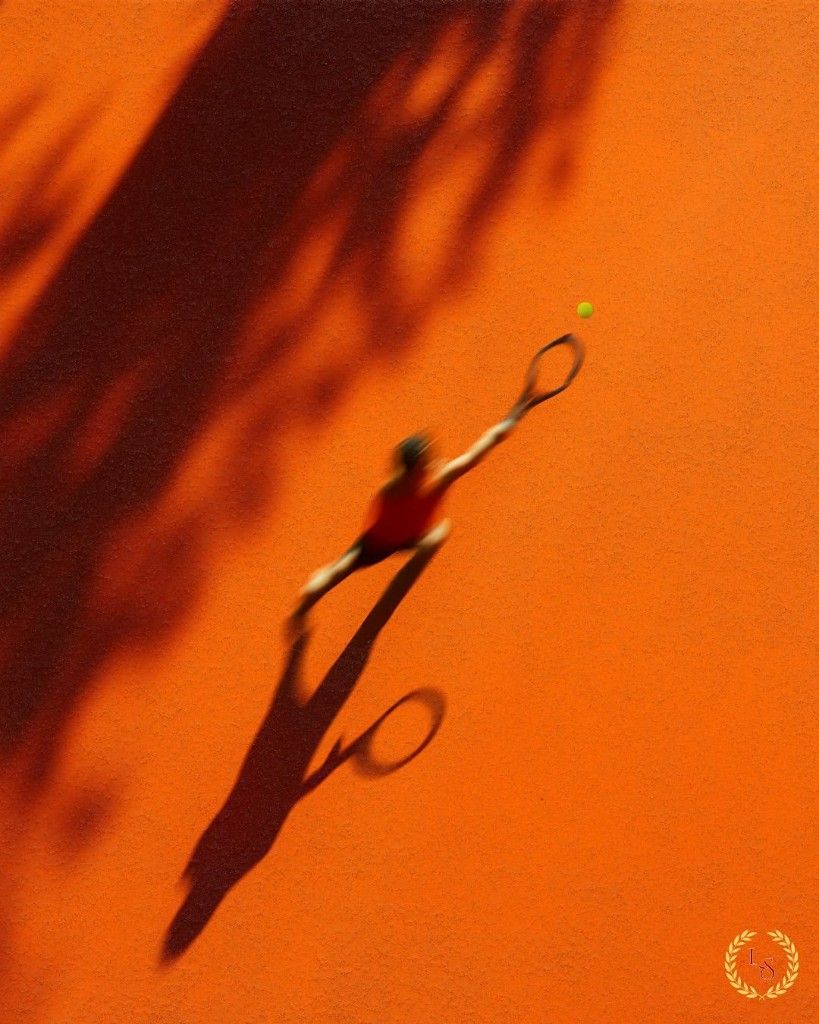 Player stretching for a shot on a clay padel court