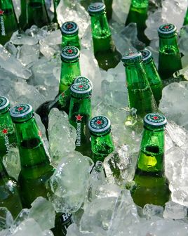 Dozens of Heineken bottles stashed in ice.