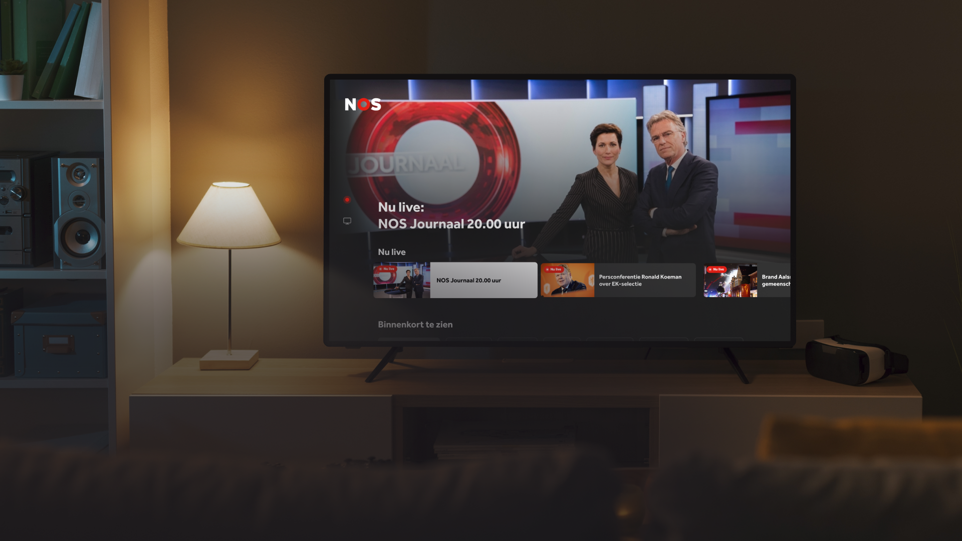 Living room setting with a smart TV displaying the NOS Live connected TV app.